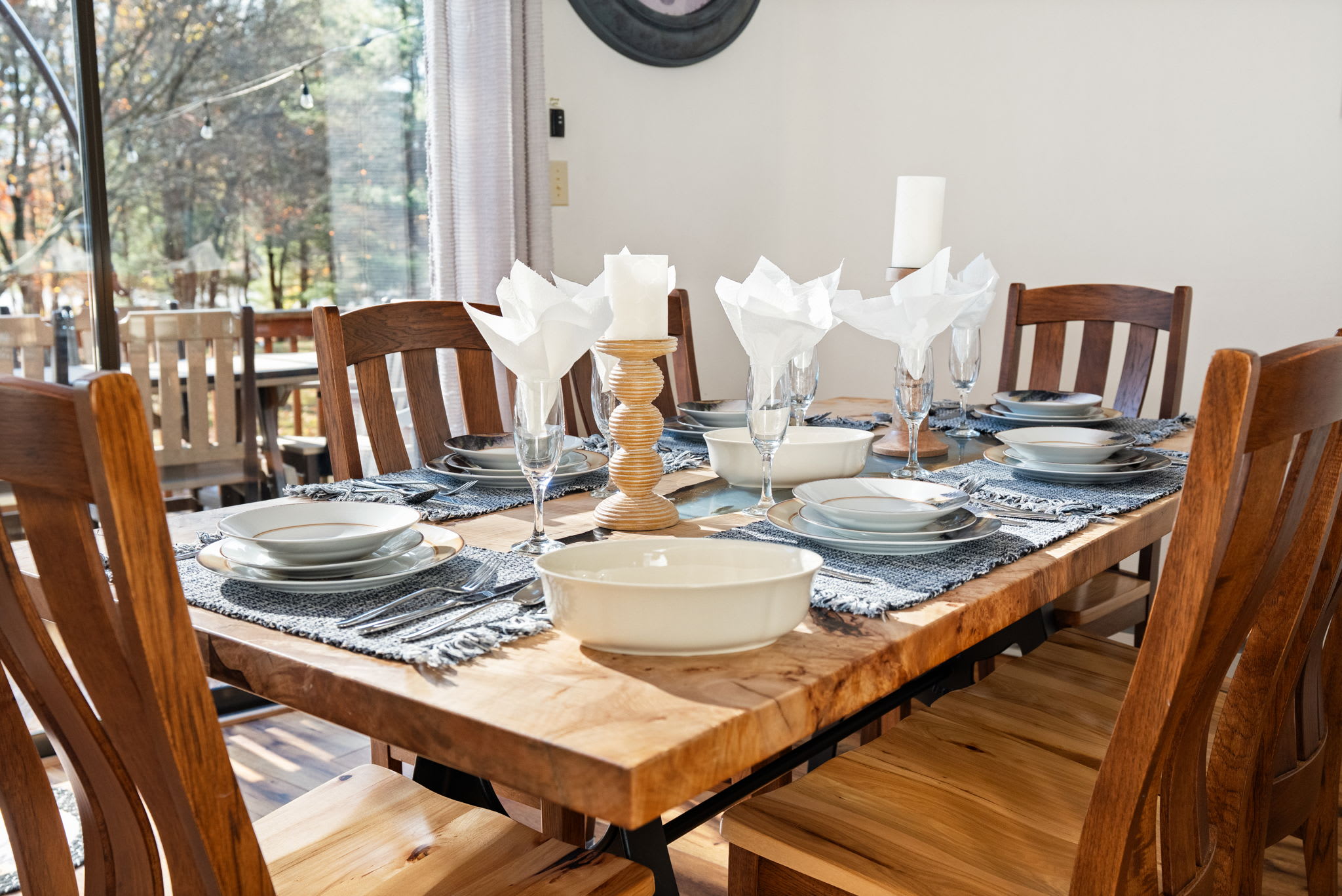 Dining table set for family meals with view into kitchen - ready for memorable gatherings