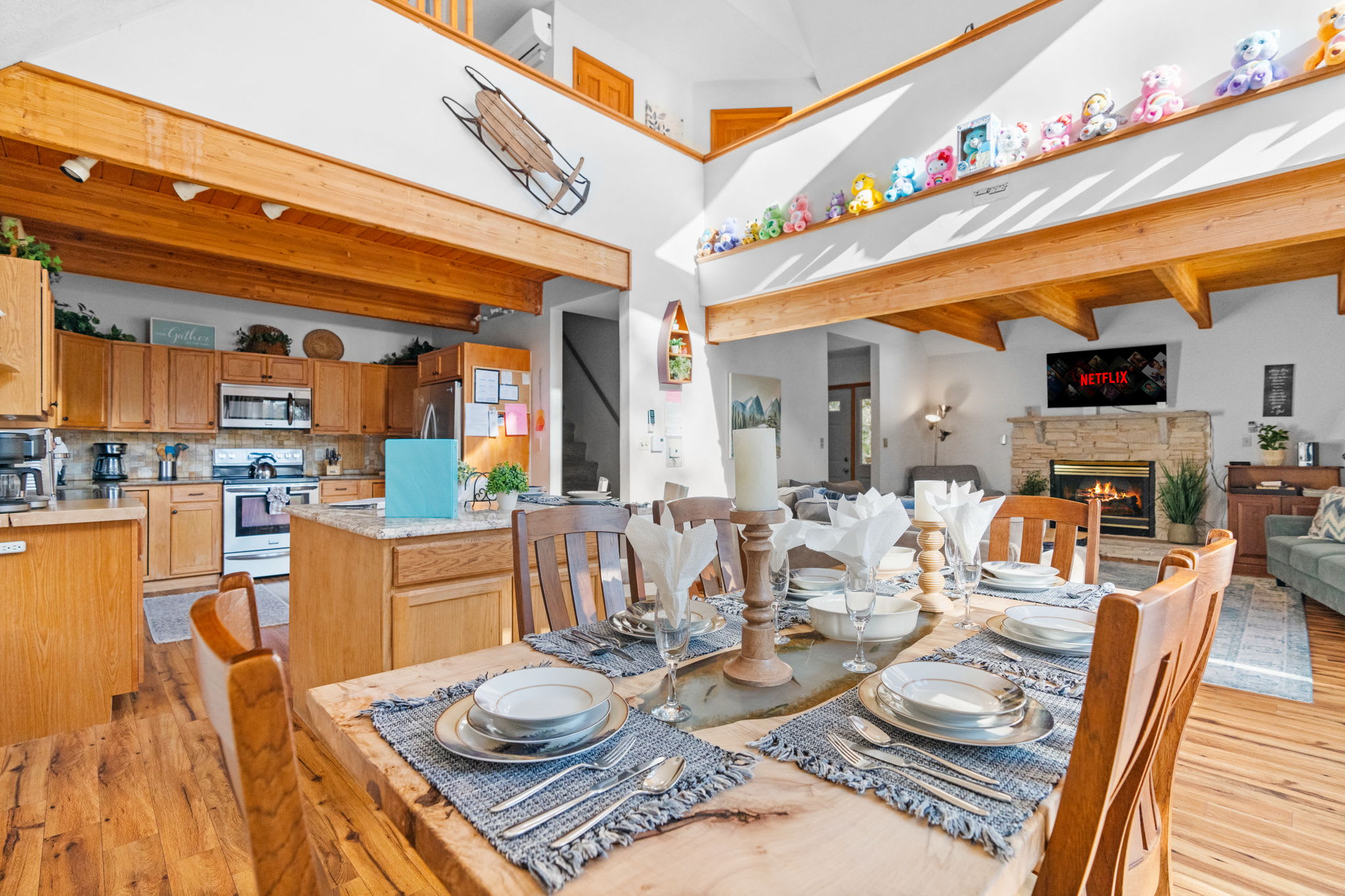 Dining table with vaulted ceiling and kitchen views - plenty of space for family dinners