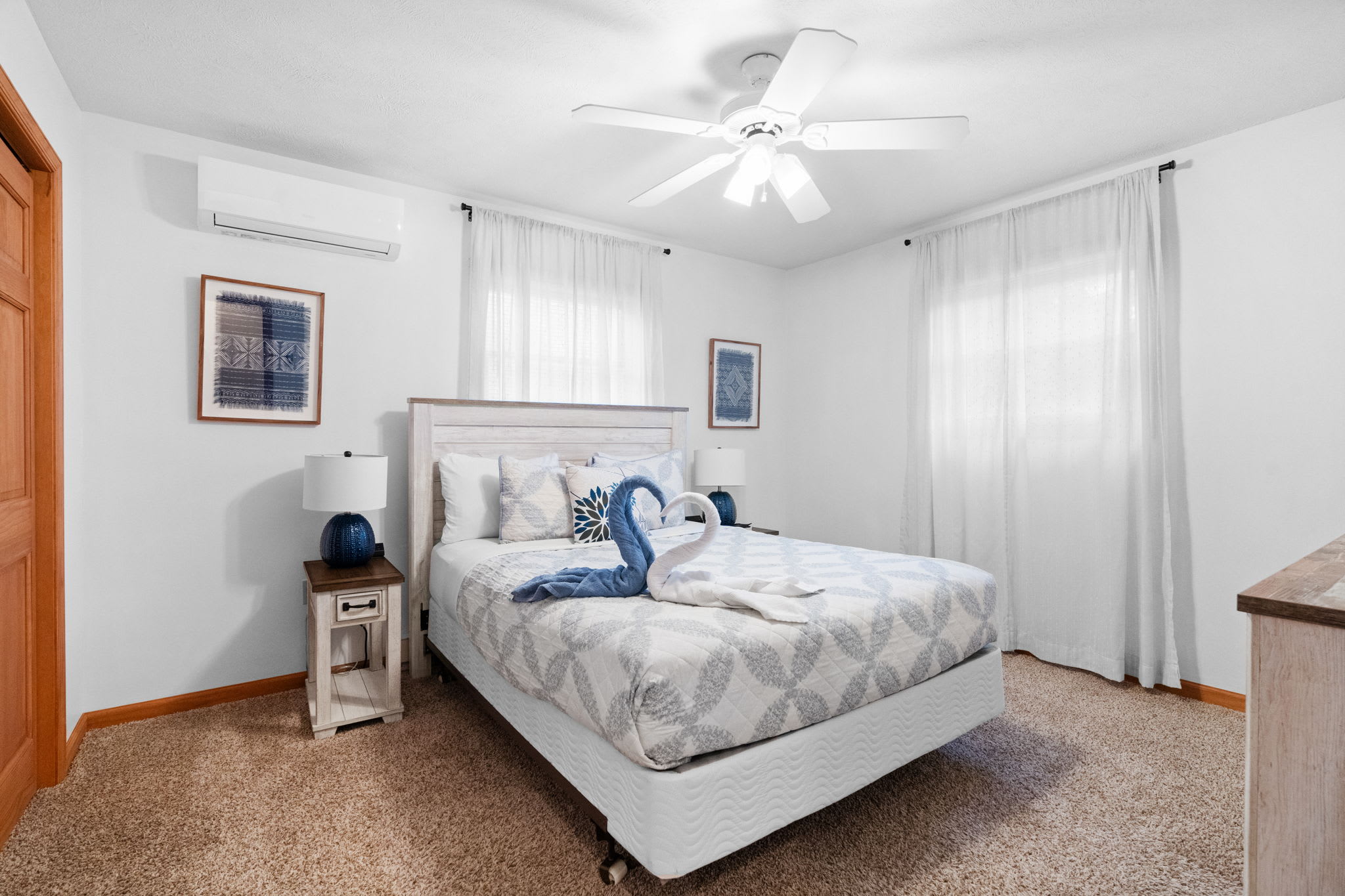 Second bedroom with comfortable bedding and side table - cozy accommodations for a restful stay