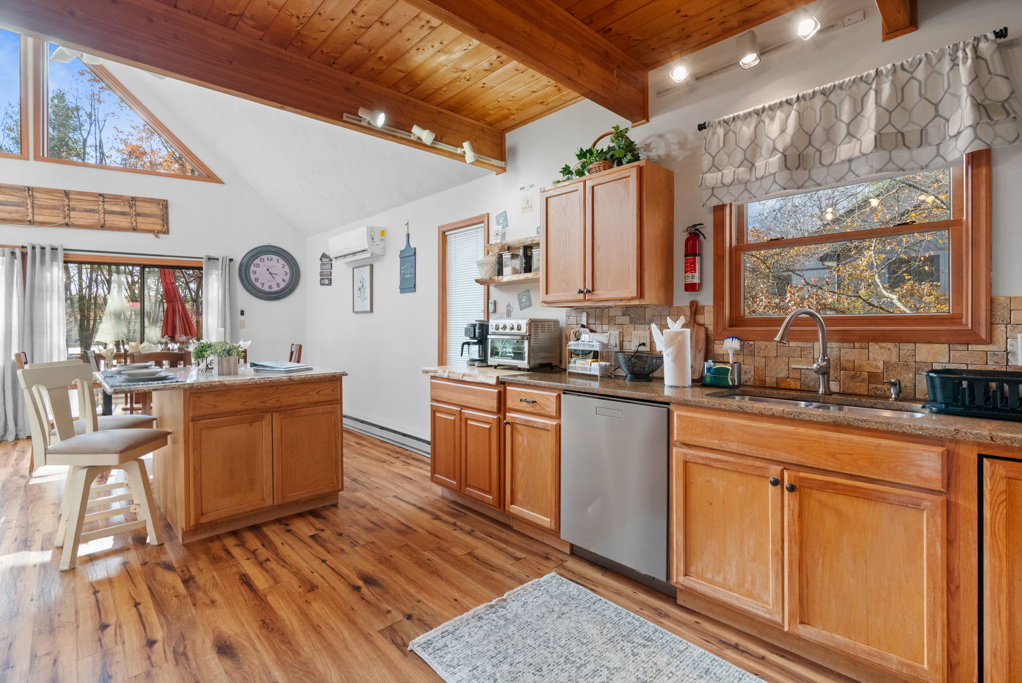 First bedroom with cozy bedding and nightstand - restful accommodations for a good night's sleep