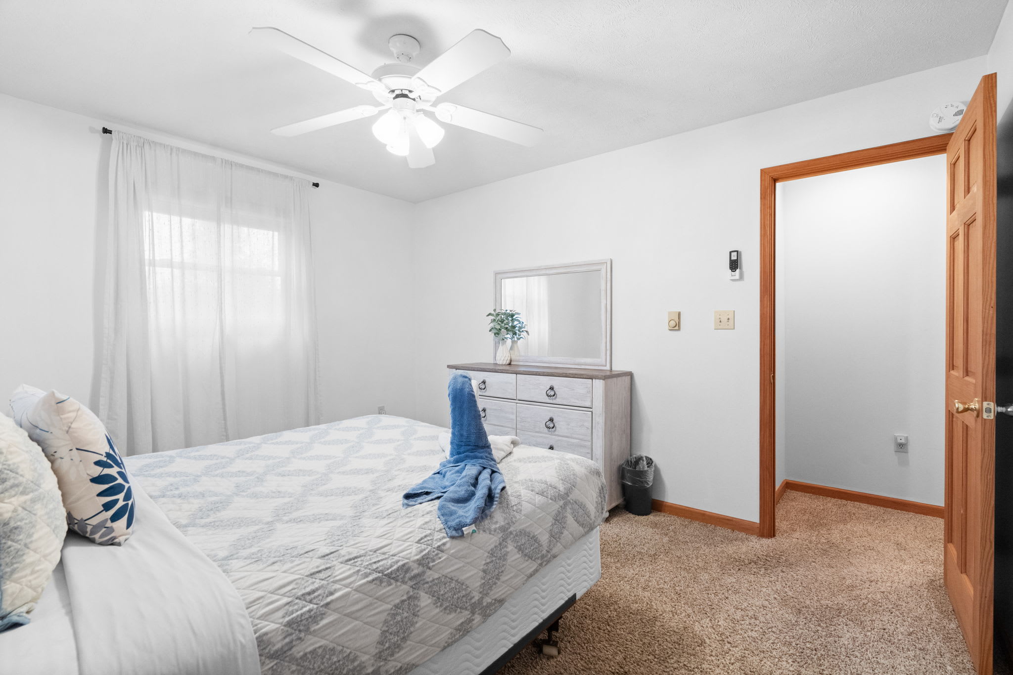 Bedroom with hardwood floors and natural lighting - well-appointed sleeping quarters