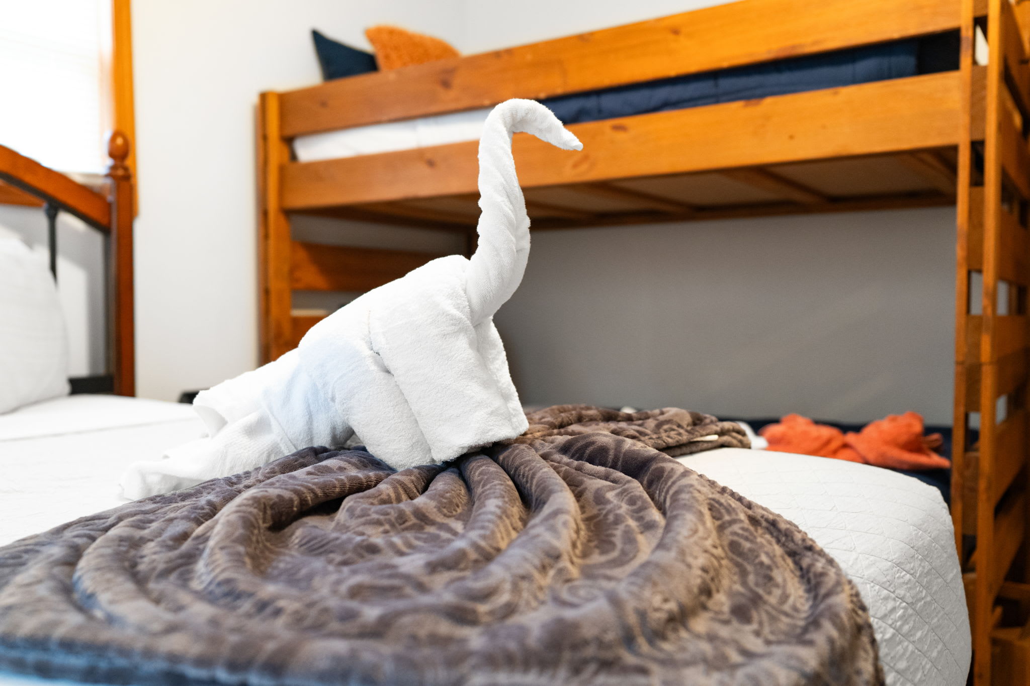 Second bedroom with natural light and comfortable bedding - restful sleeping area