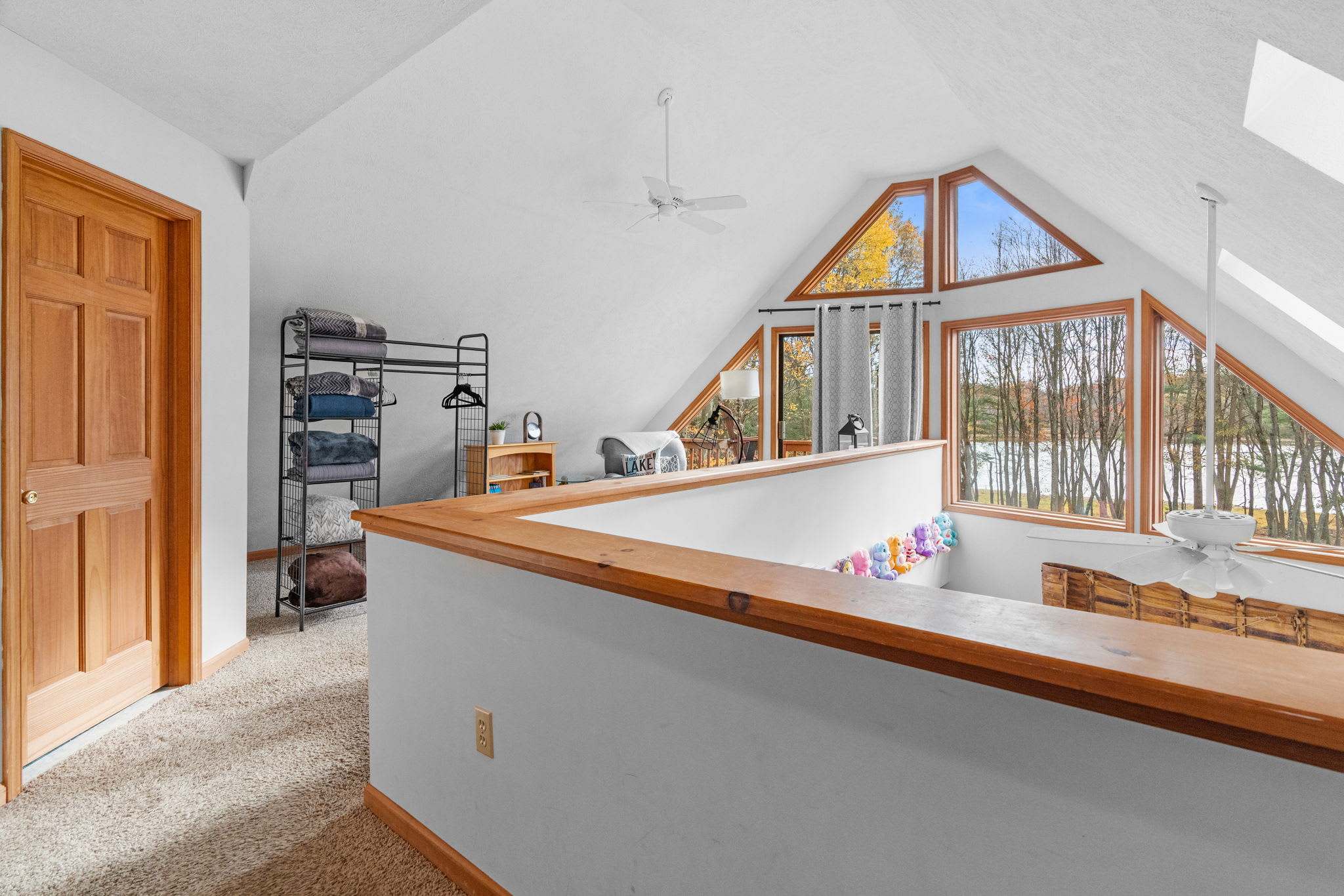 Loft bedroom with vaulted ceiling and wood details