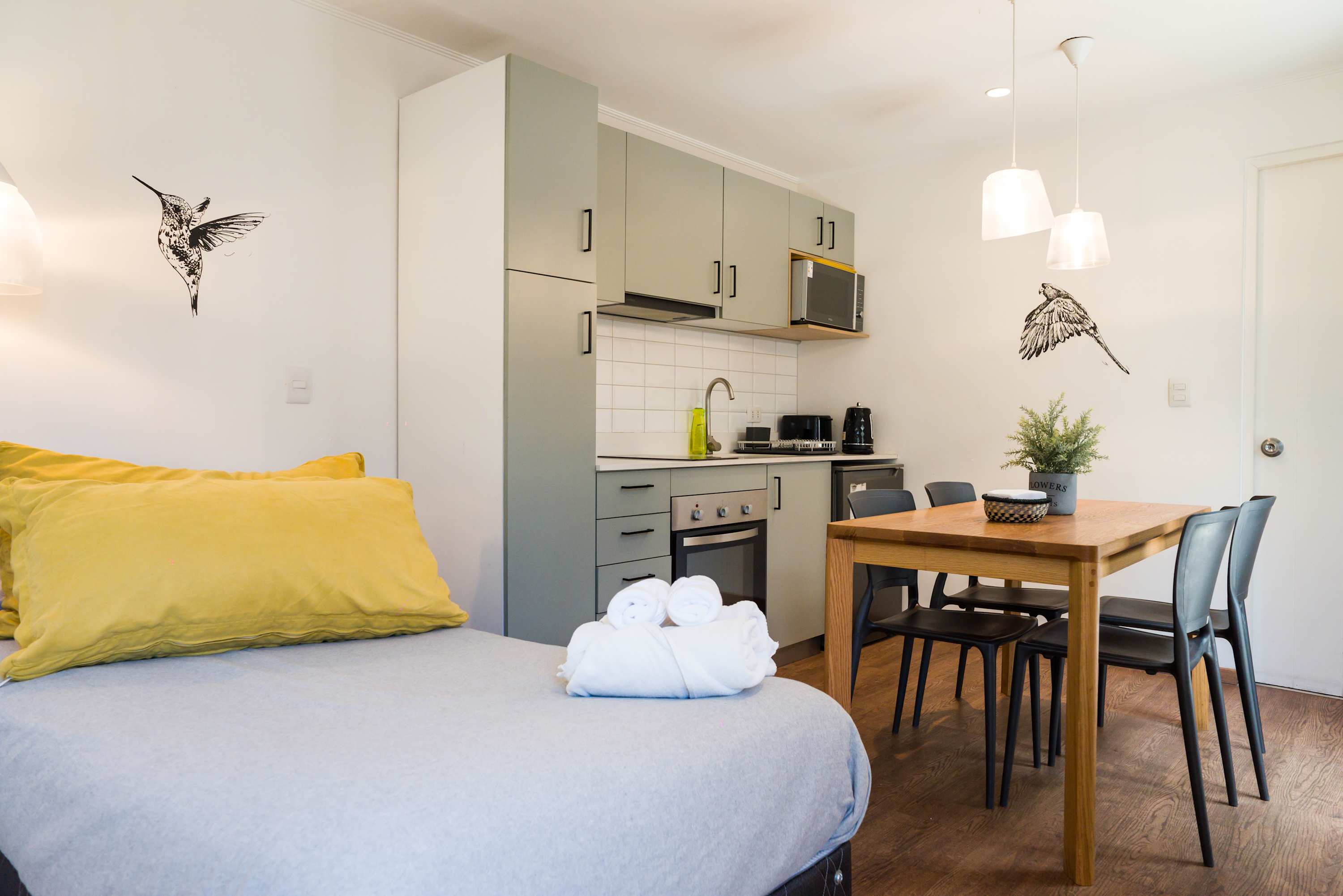 Cozy studio with a modern kitchen and dining area, perfect for a comfortable stay in the heart of Chile.