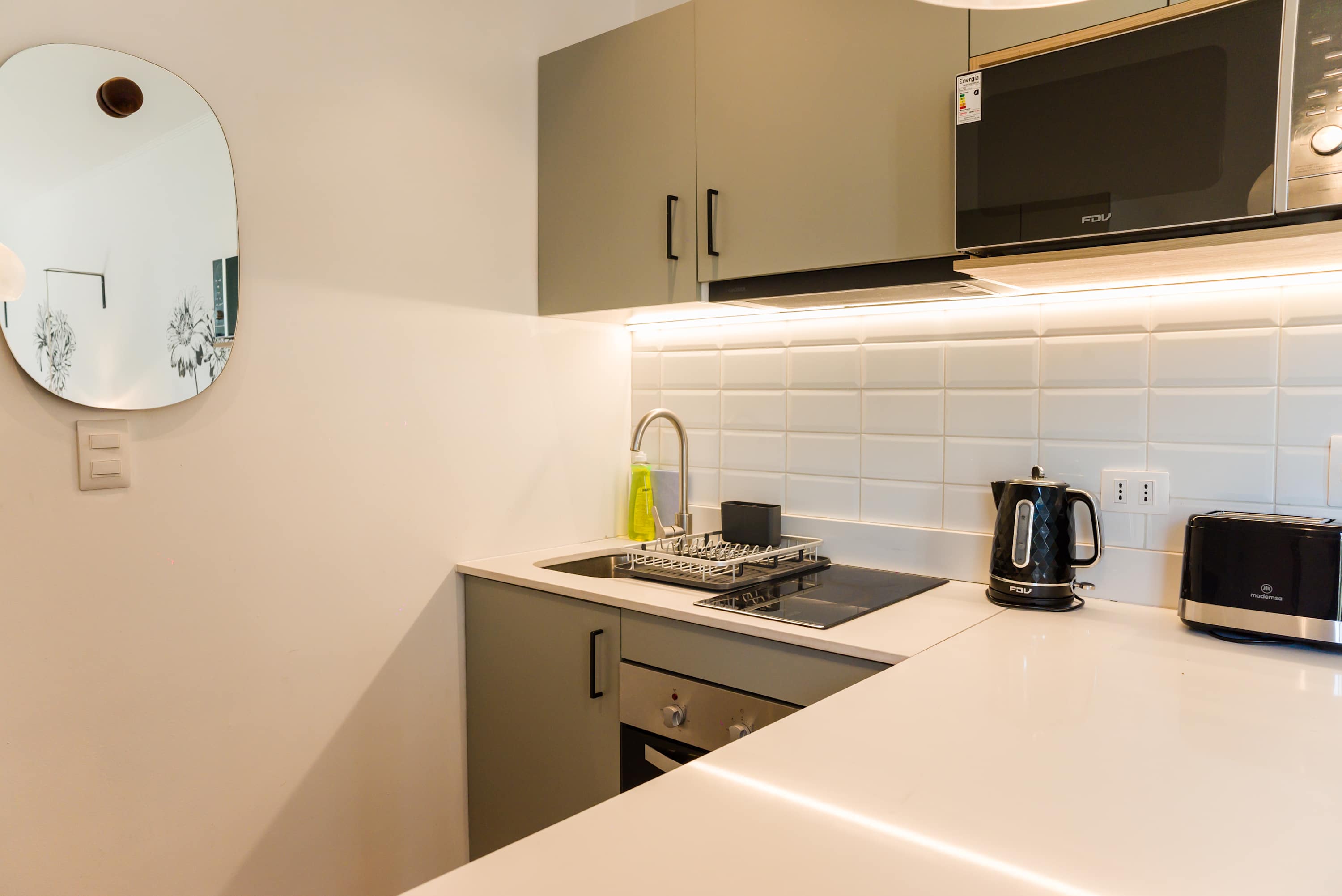 Modern and efficient kitchen with all essentials for a comfortable stay.