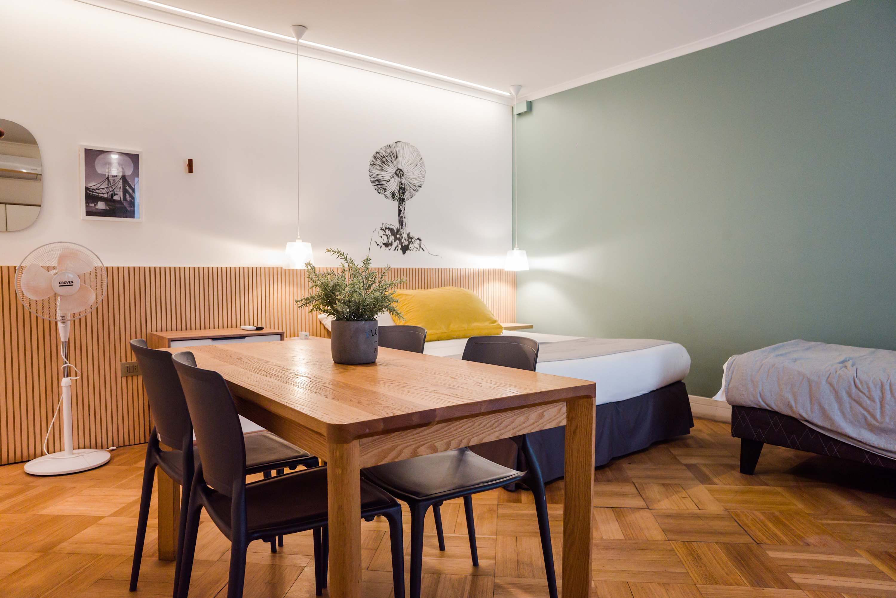 Charming studio with cozy beds and a stylish dining area, perfect for a relaxing stay in Chile.