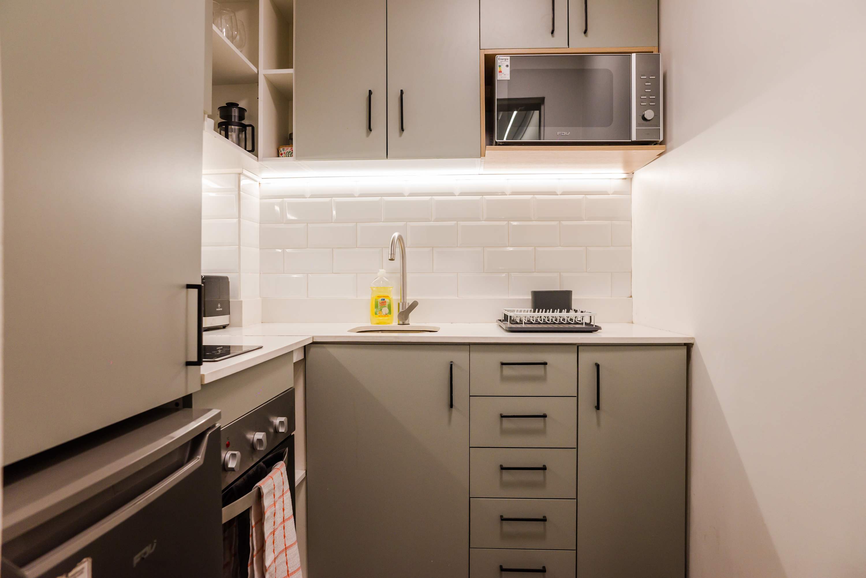 Modern and efficient kitchen with sleek appliances and ample storage, perfect for preparing meals during your stay.