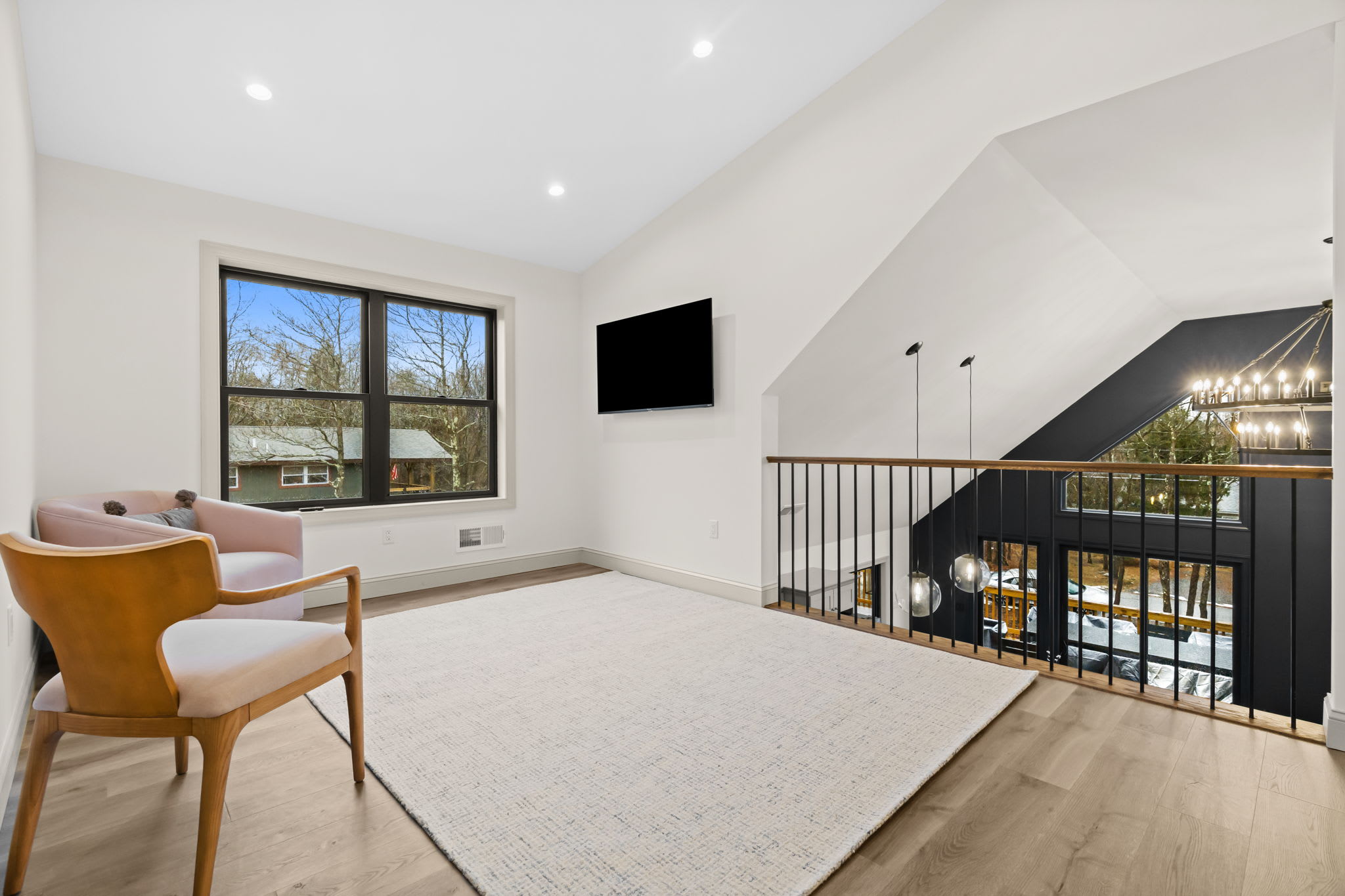 Relax in the loft seating area with leather chairs and sweeping views through the windows
