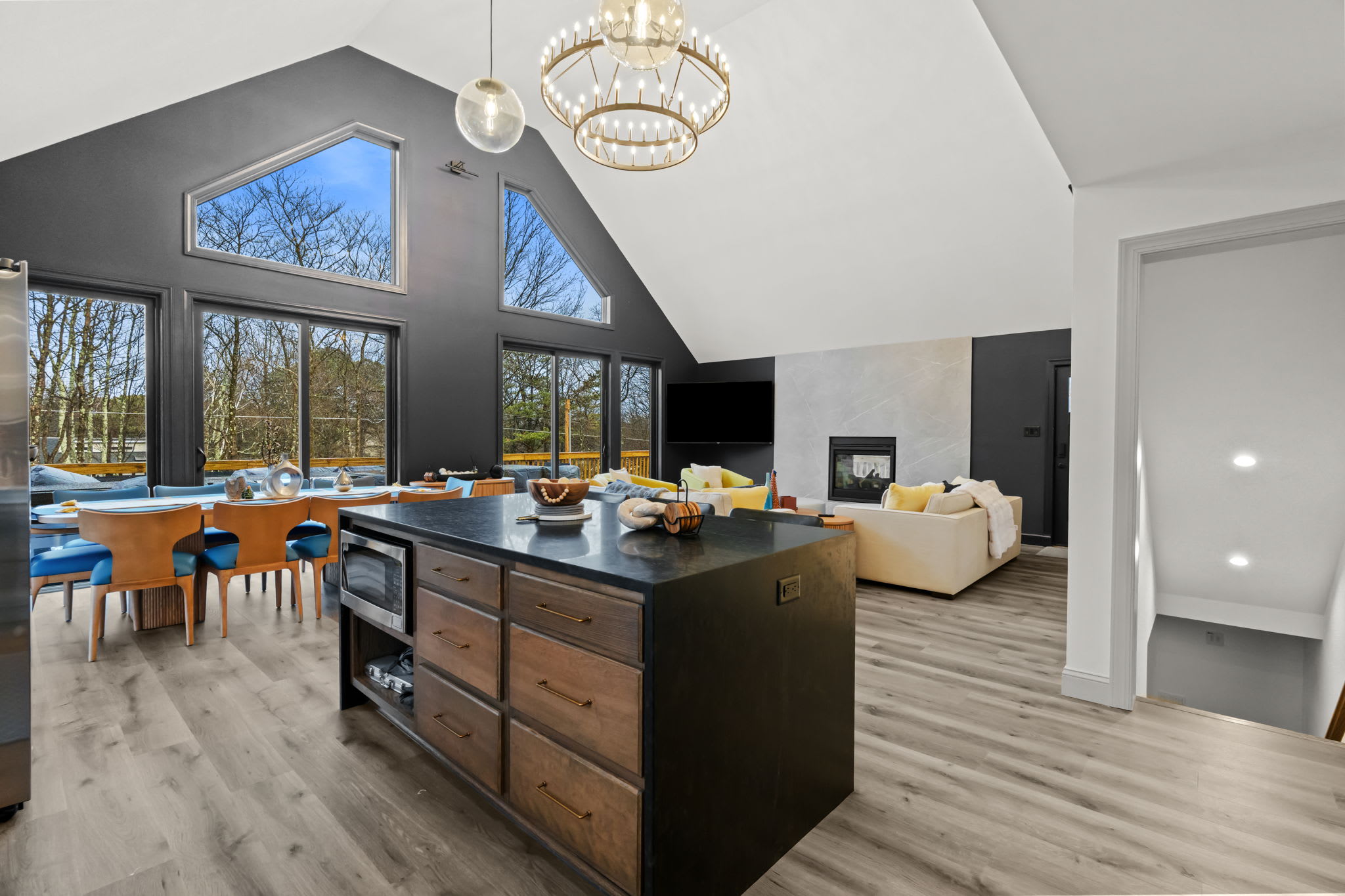 Open concept kitchen and dining area with stunning floor-to-ceiling windows