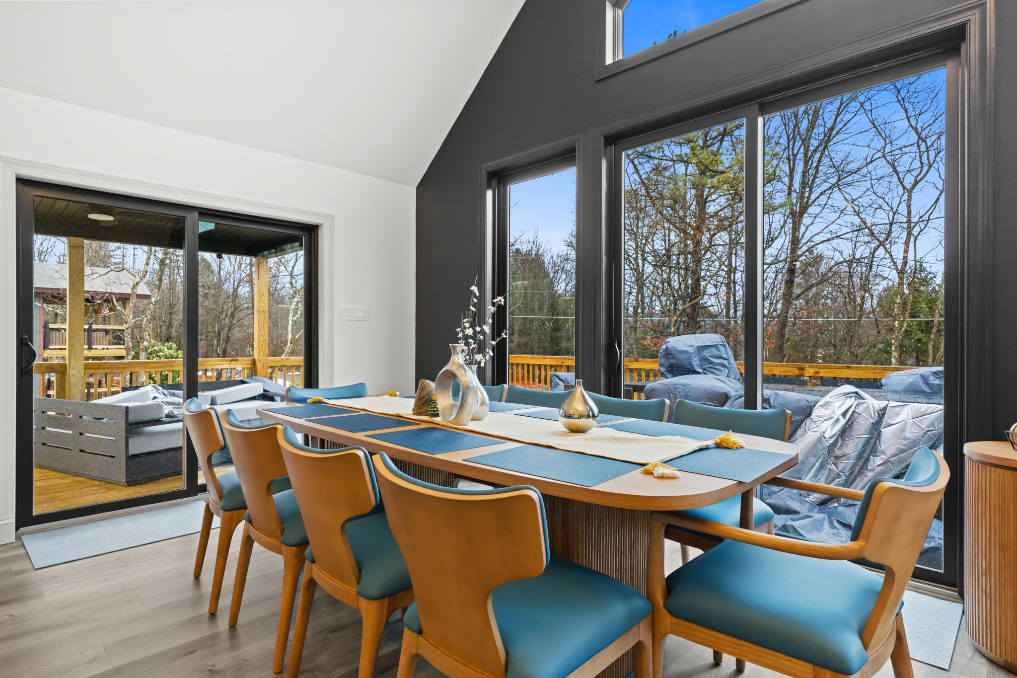 Dine with a view through floor-to-ceiling windows and step out to the deck