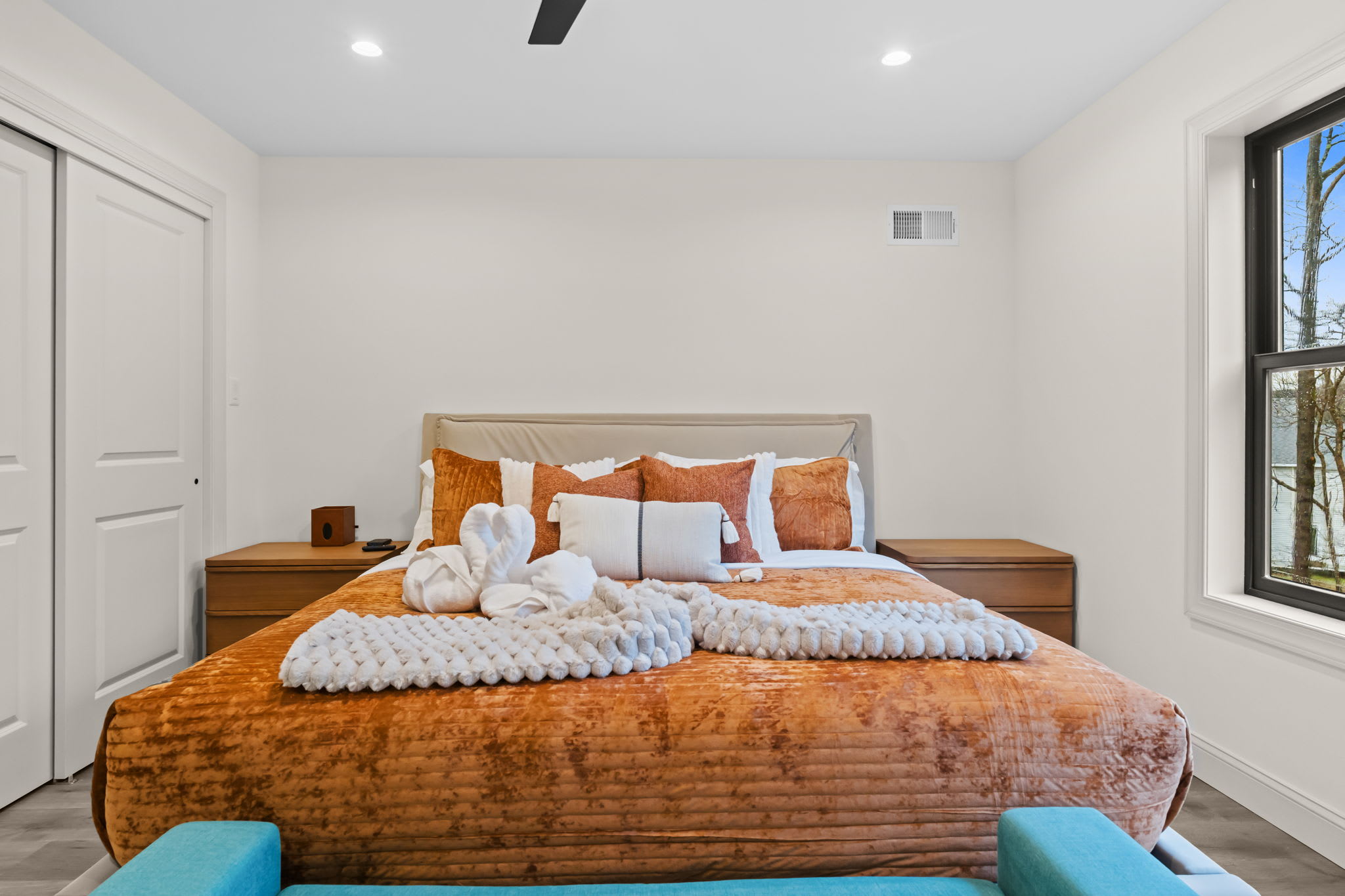 Fall into a peaceful sleep in the warm and inviting bedroom with earthy tones