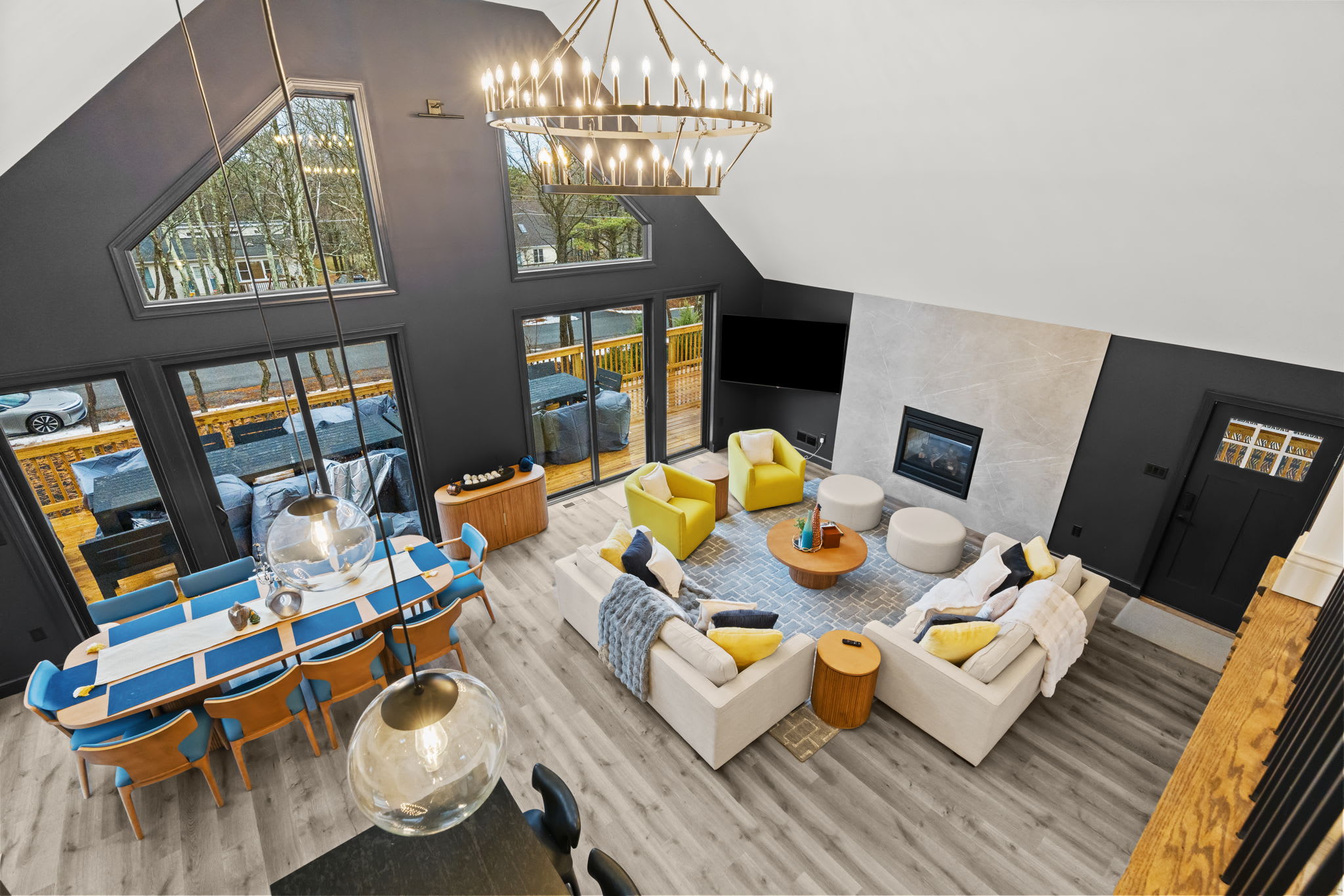 Admire the open layout and statement chandelier from the loft overlook