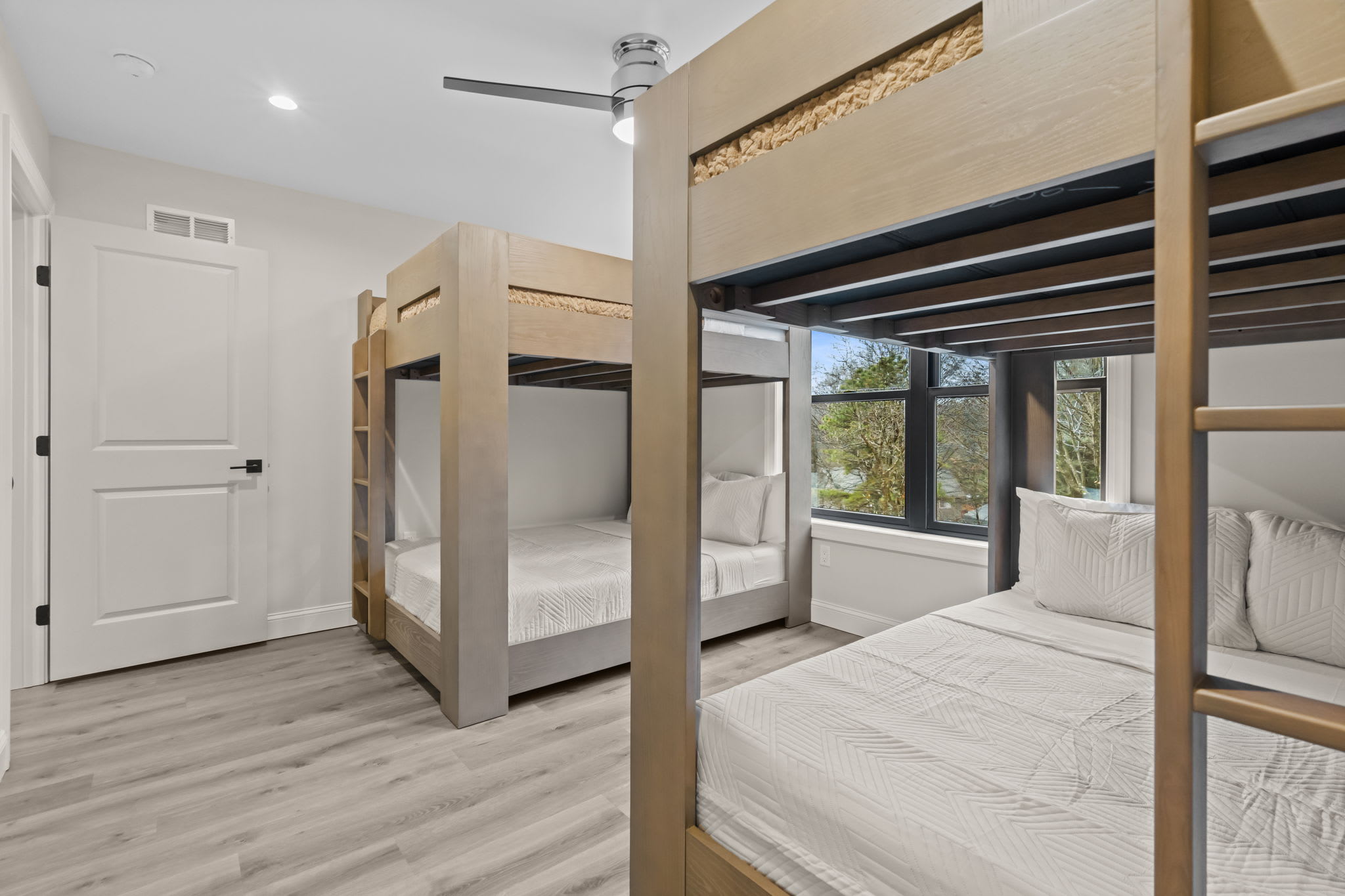 Kids and adults alike will love these custom built-in queen bunk beds