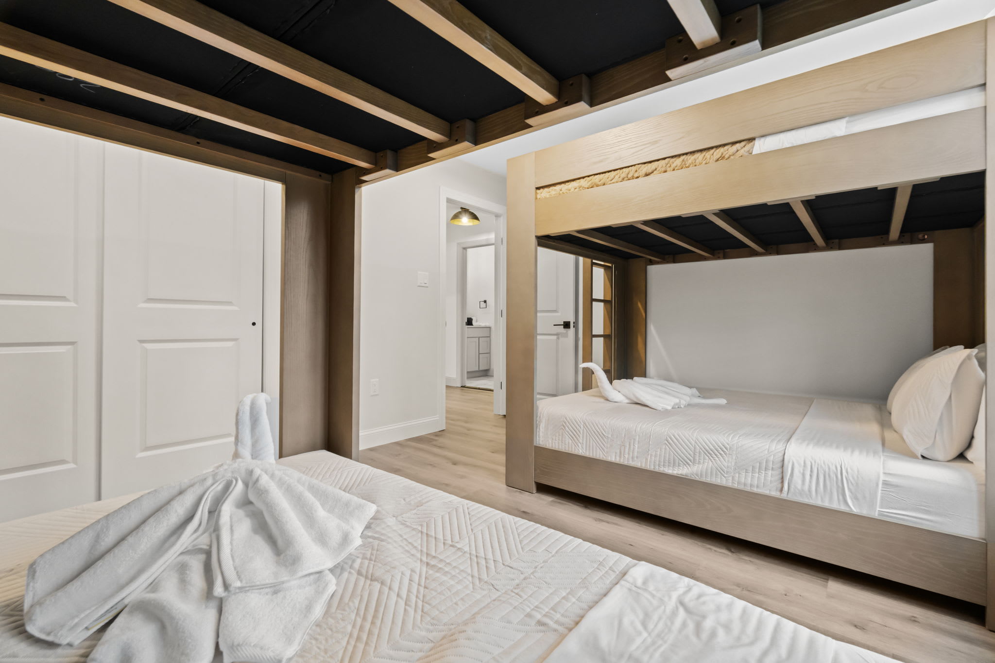 Rest easy in the charming bunk room with built-in beds and cozy bedding