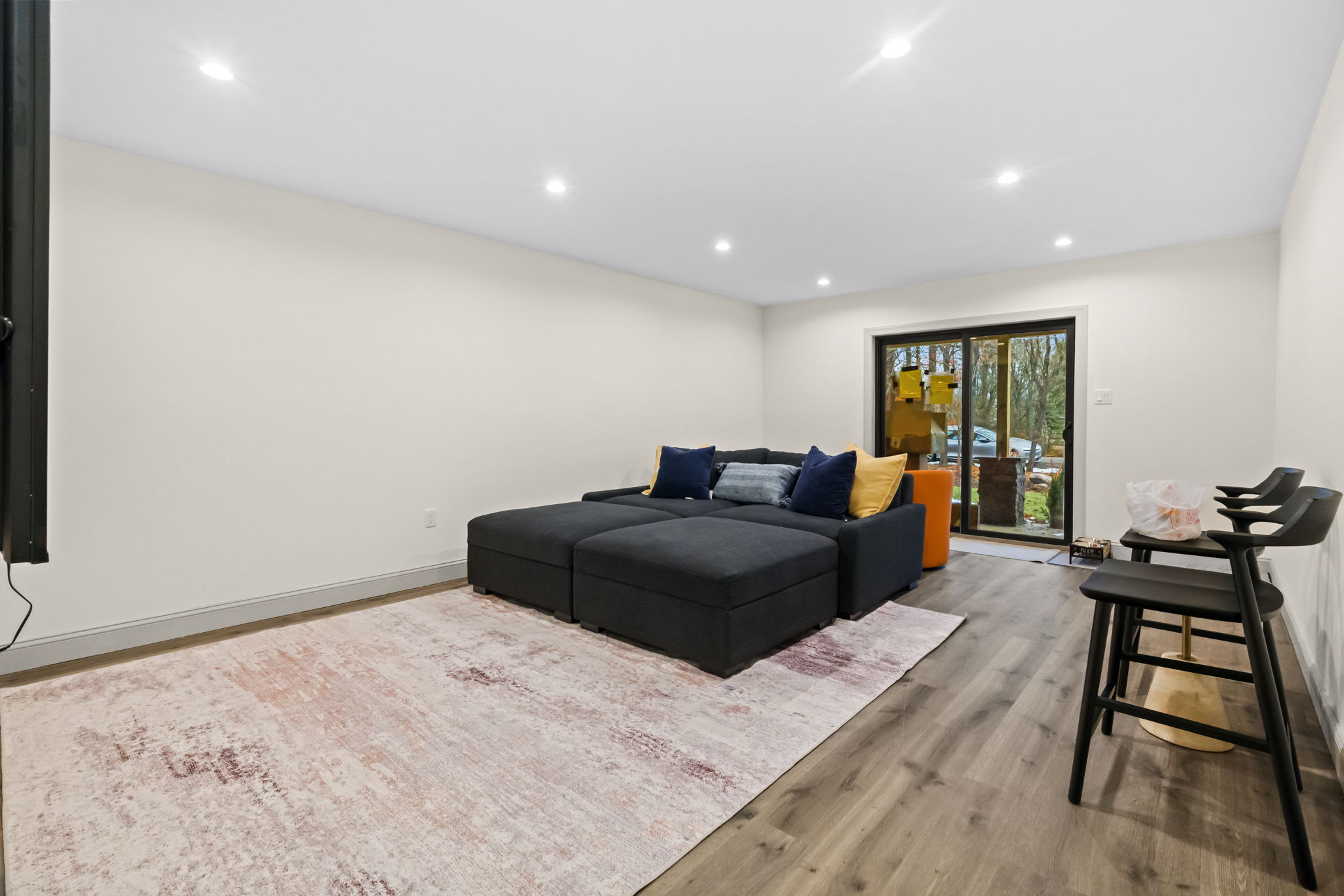 Unwind in the spacious lower level lounge with comfy seating and natural light