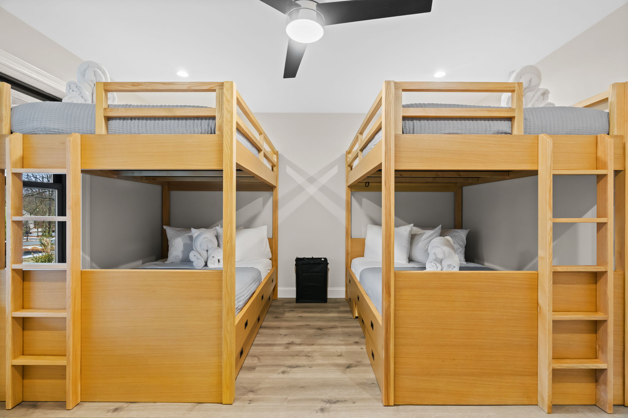 Spacious bunk room with custom wooden bunks perfect for kids and group getaways