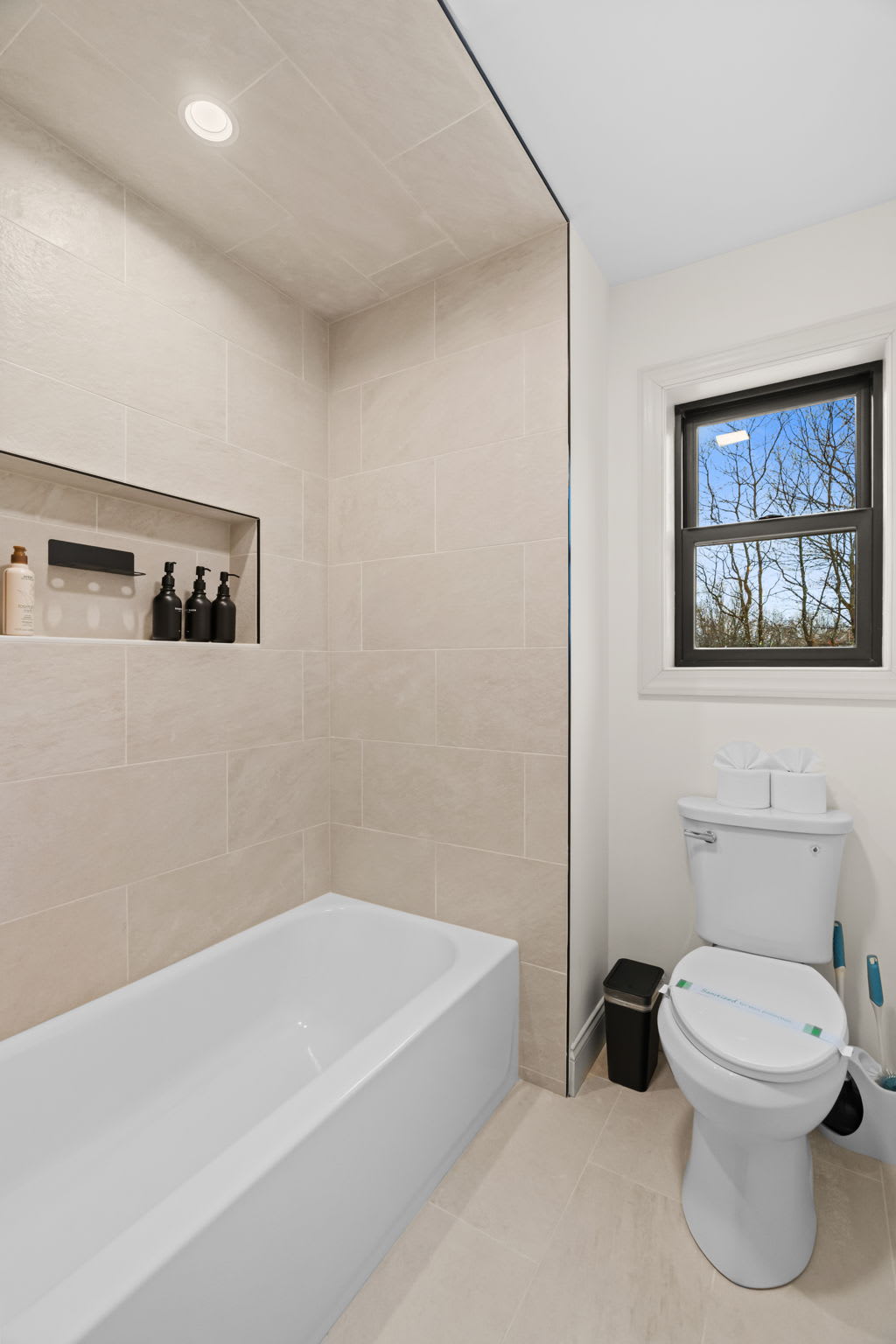 Enjoy a relaxing bath with views of the surrounding trees