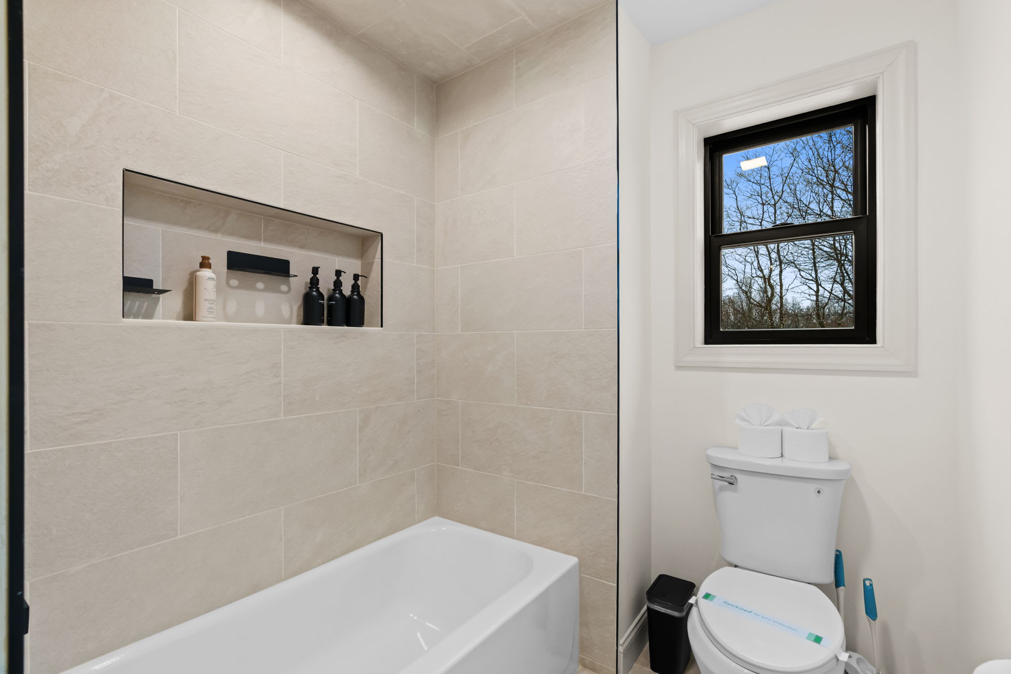 Soak away the day in the deep tub with natural light streaming through the window