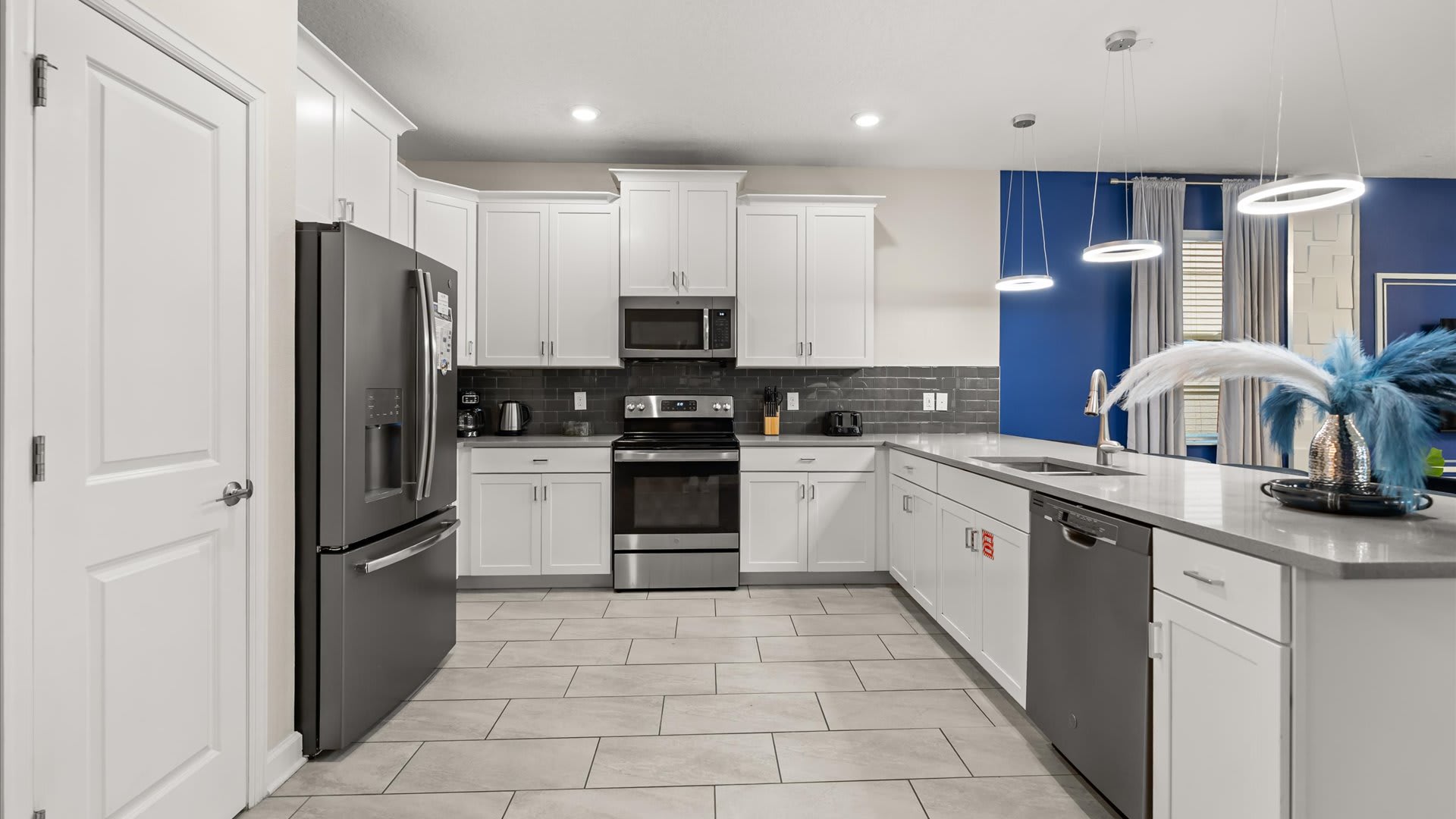 Modern family kitchen with silver appliances 