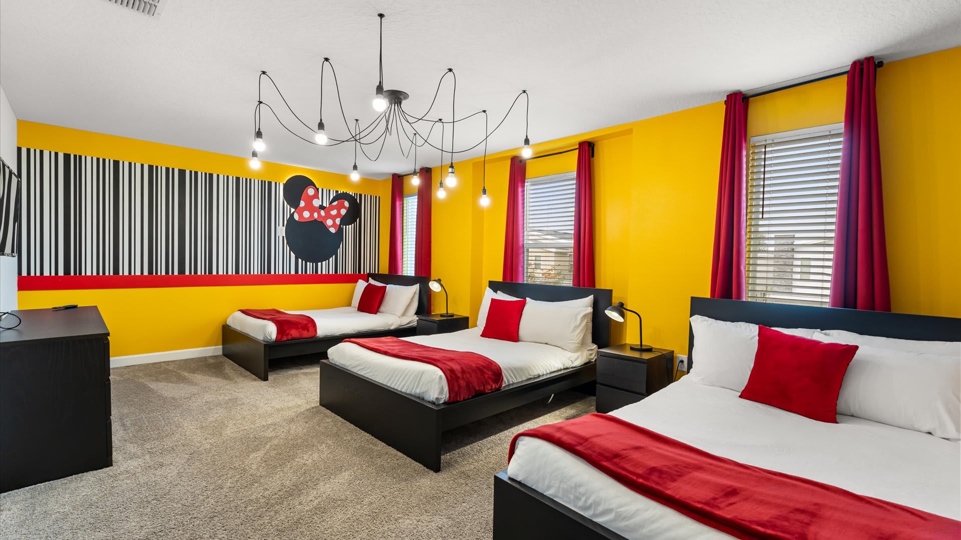 Mickey Mouse-themed bedroom with 3 double beds and smart TV