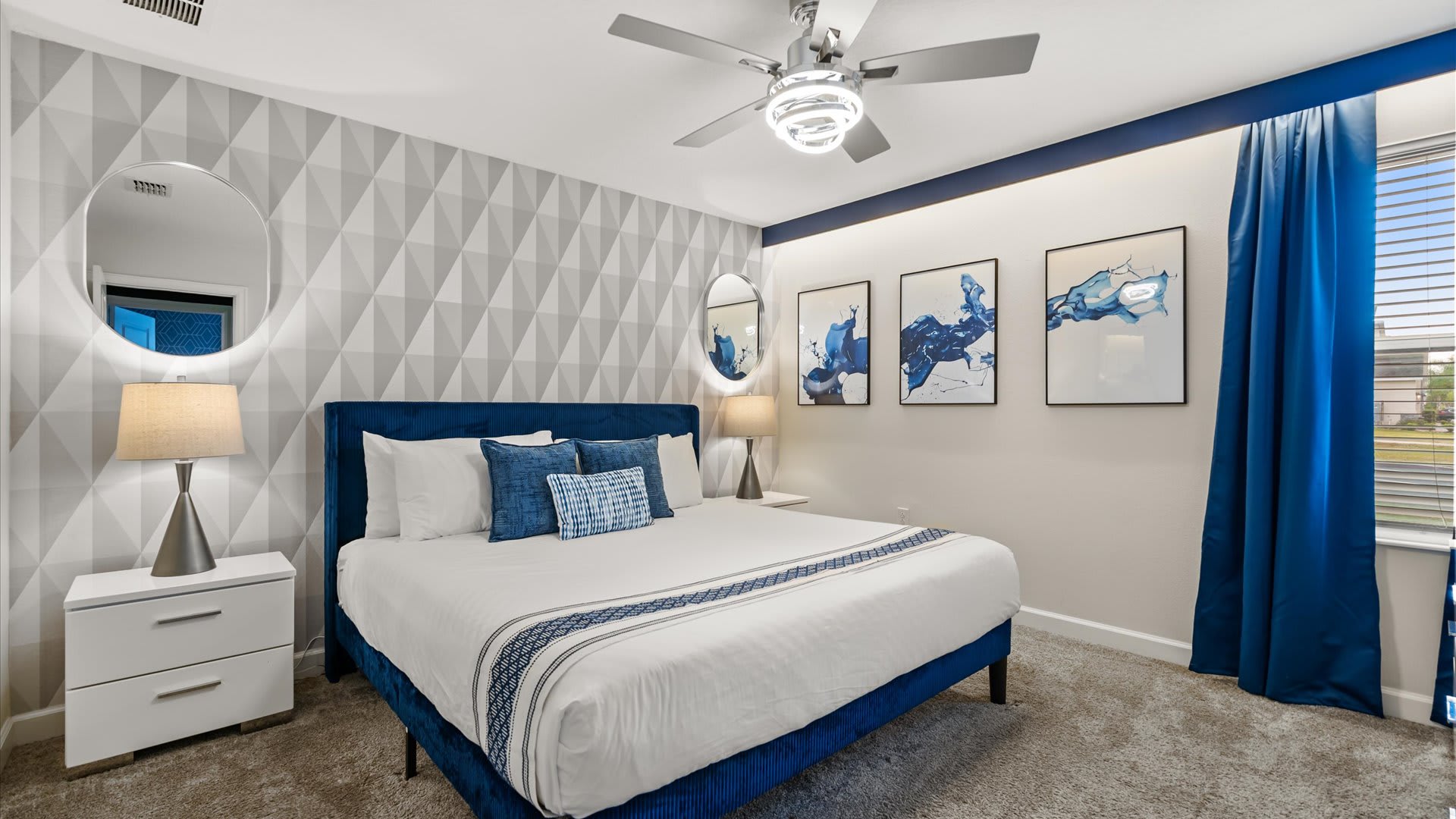 Stylish king bedroom with fresh linens and smart TV