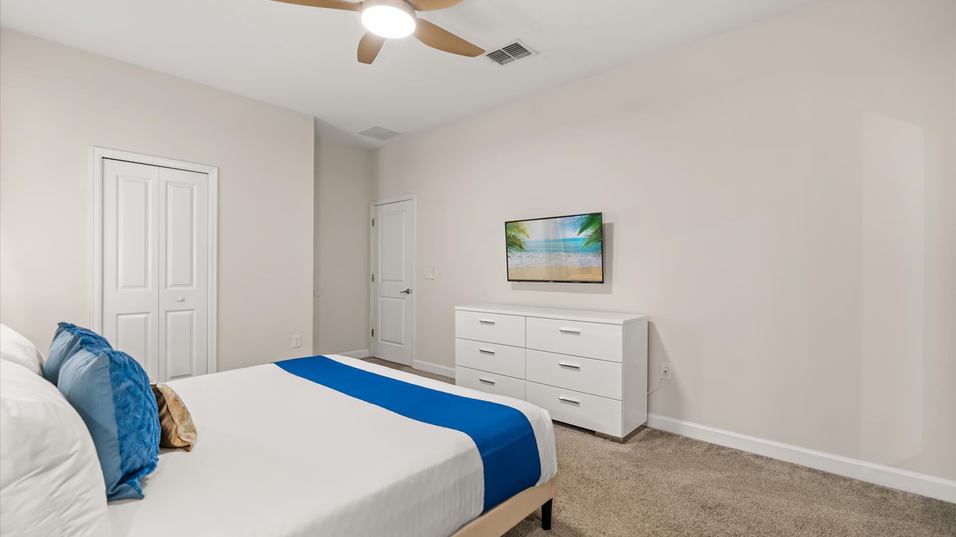 Vibrant King bedroom with smart TV and en-suite bathroom 