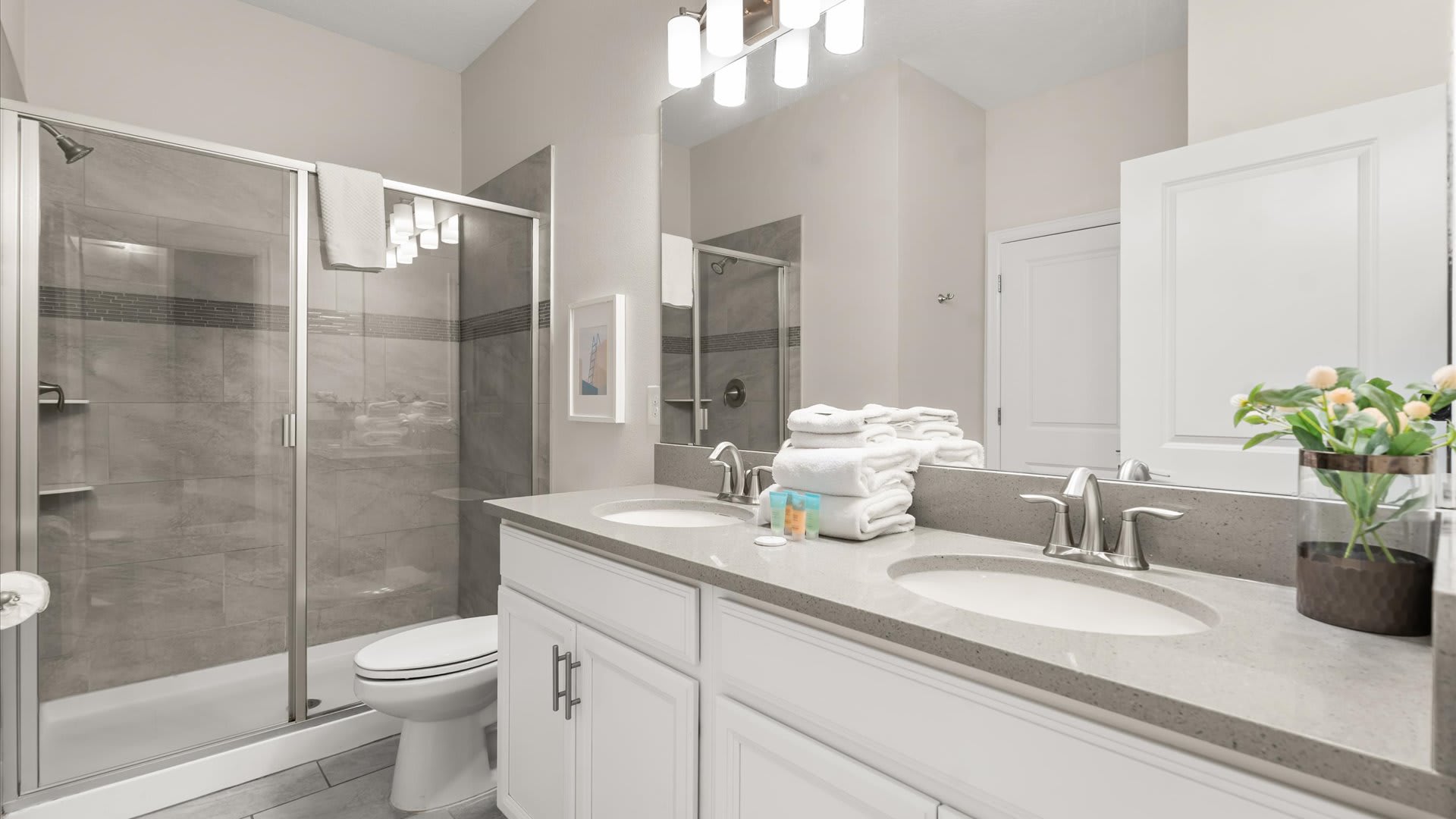 En-suite bathroom with double vanity and standing shower