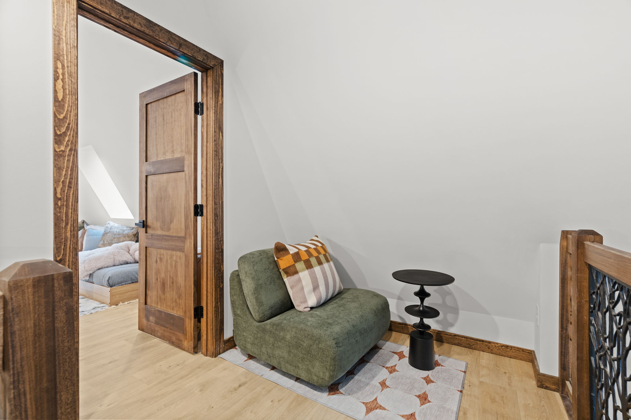 Curl up with a book in the cozy reading corner at the top of the stairs