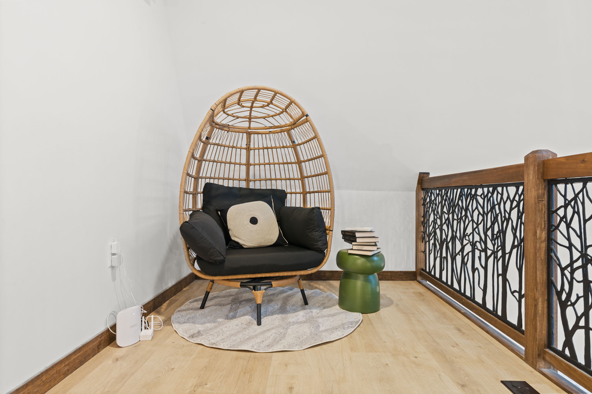 Swing into the rattan egg chair for a quiet reading moment overlooking the living room