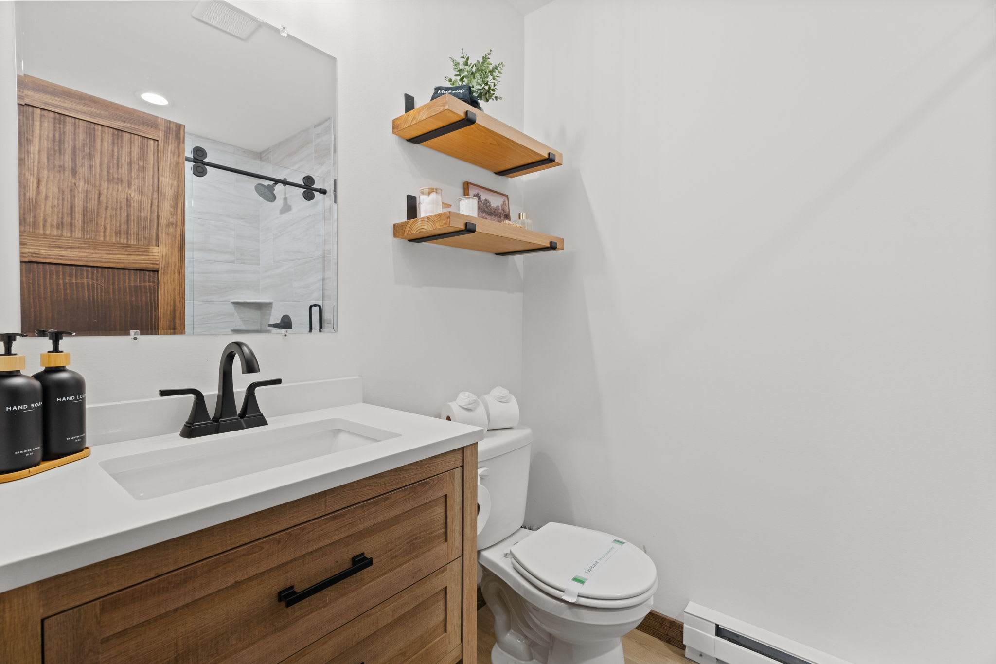 Thoughtfully curated bathroom details with fresh plants and spa-like essentials