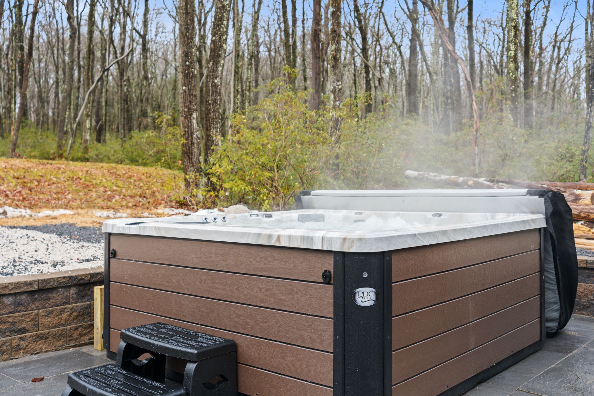 Soak away the day in the hot tub surrounded by peaceful woodland views