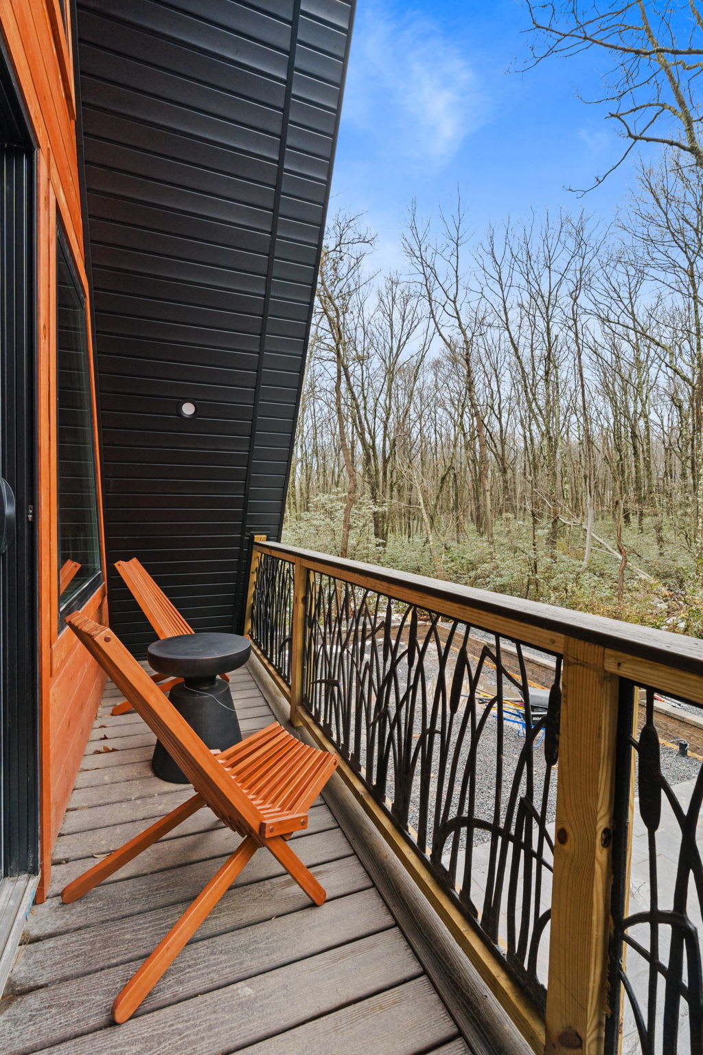 Soak in the fresh mountain air from the front deck with Adirondack seating