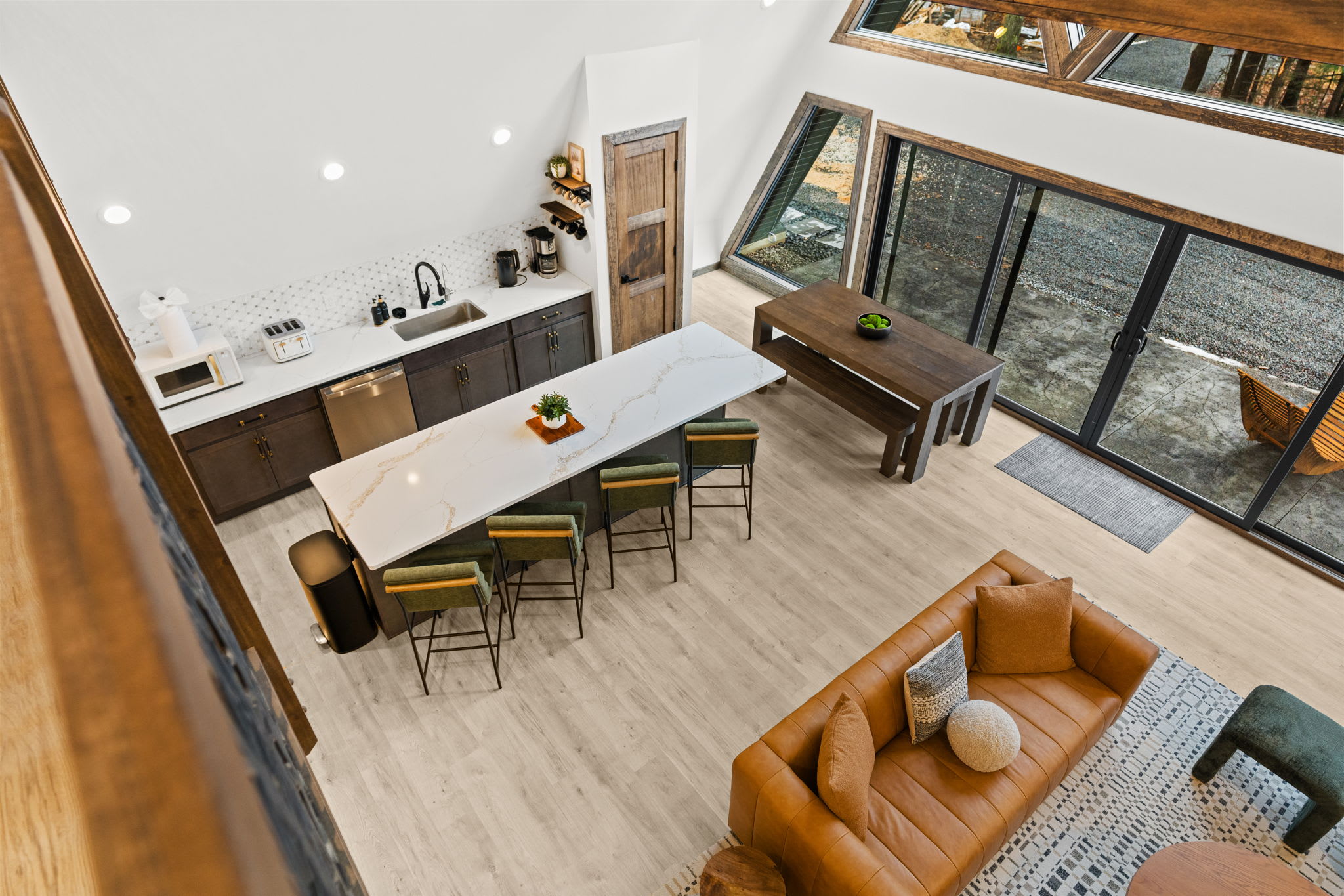 Birds-eye view of the open living space with cozy seating and dining area