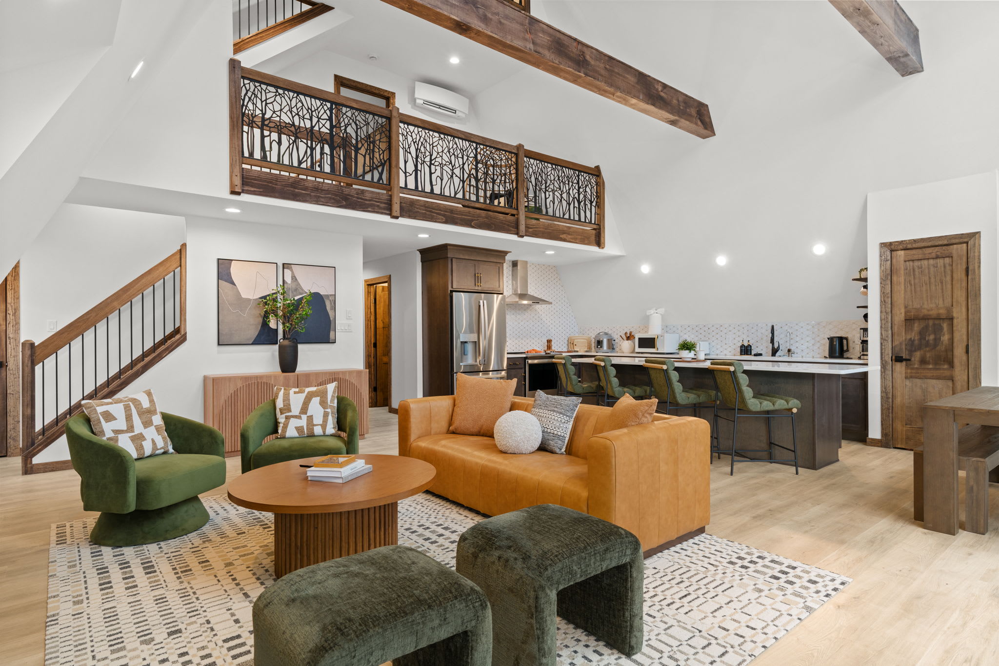 Open floor plan connects the living room, dining area, and modern kitchen.