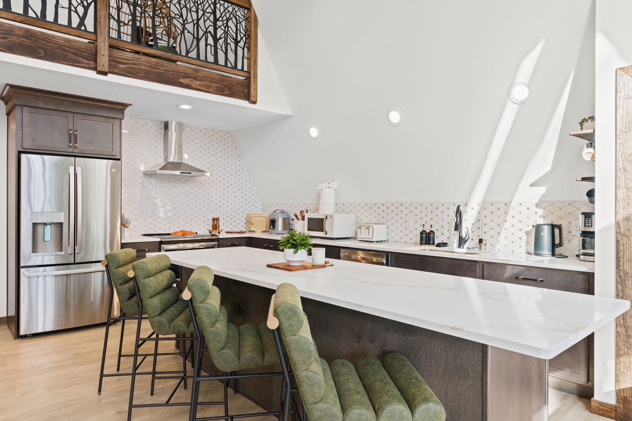 Relax in the inviting living space bathed in natural light from A-frame windows.