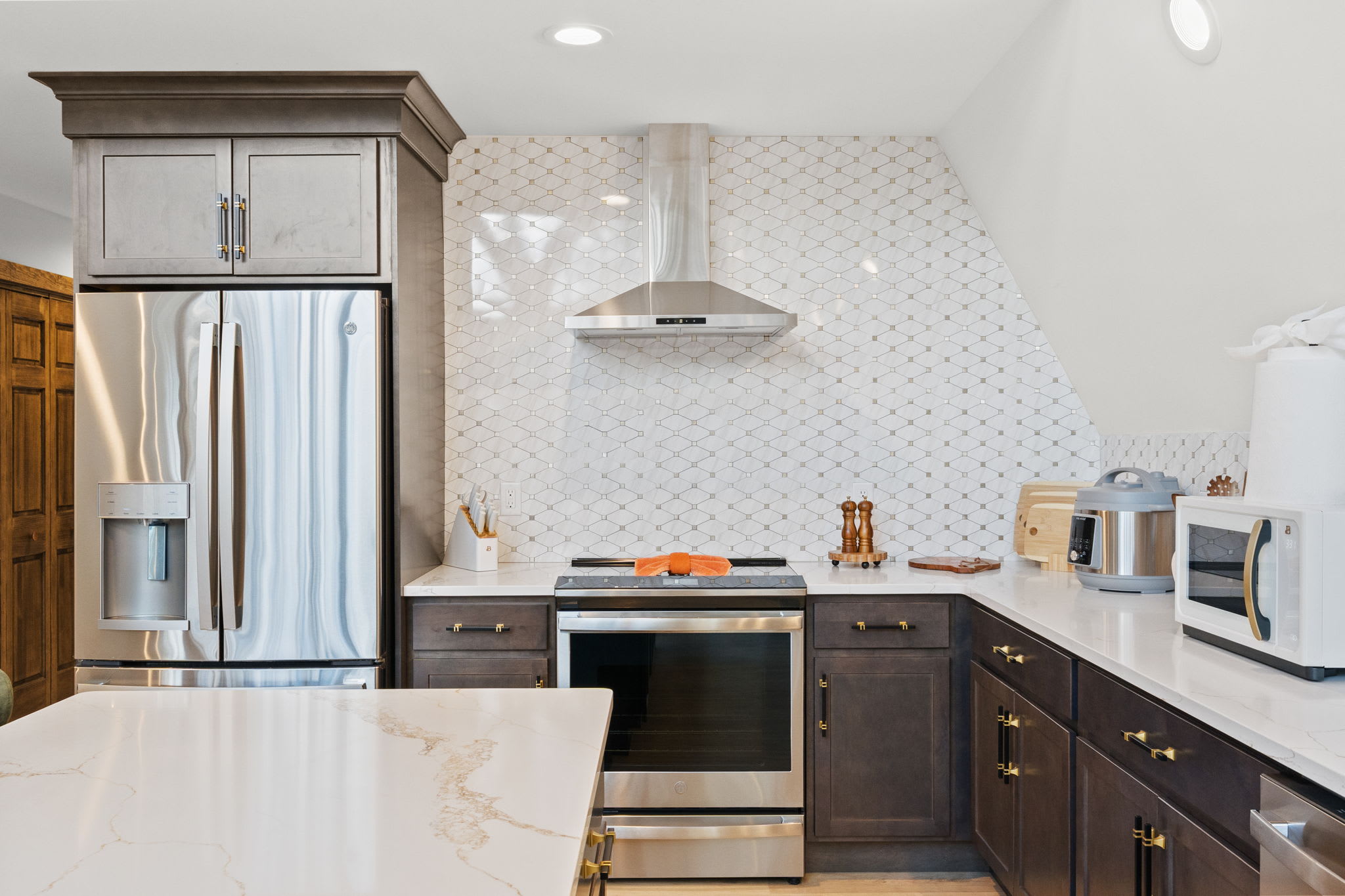 Cook up a feast in this modern kitchen with subway tile and stainless appliances.
