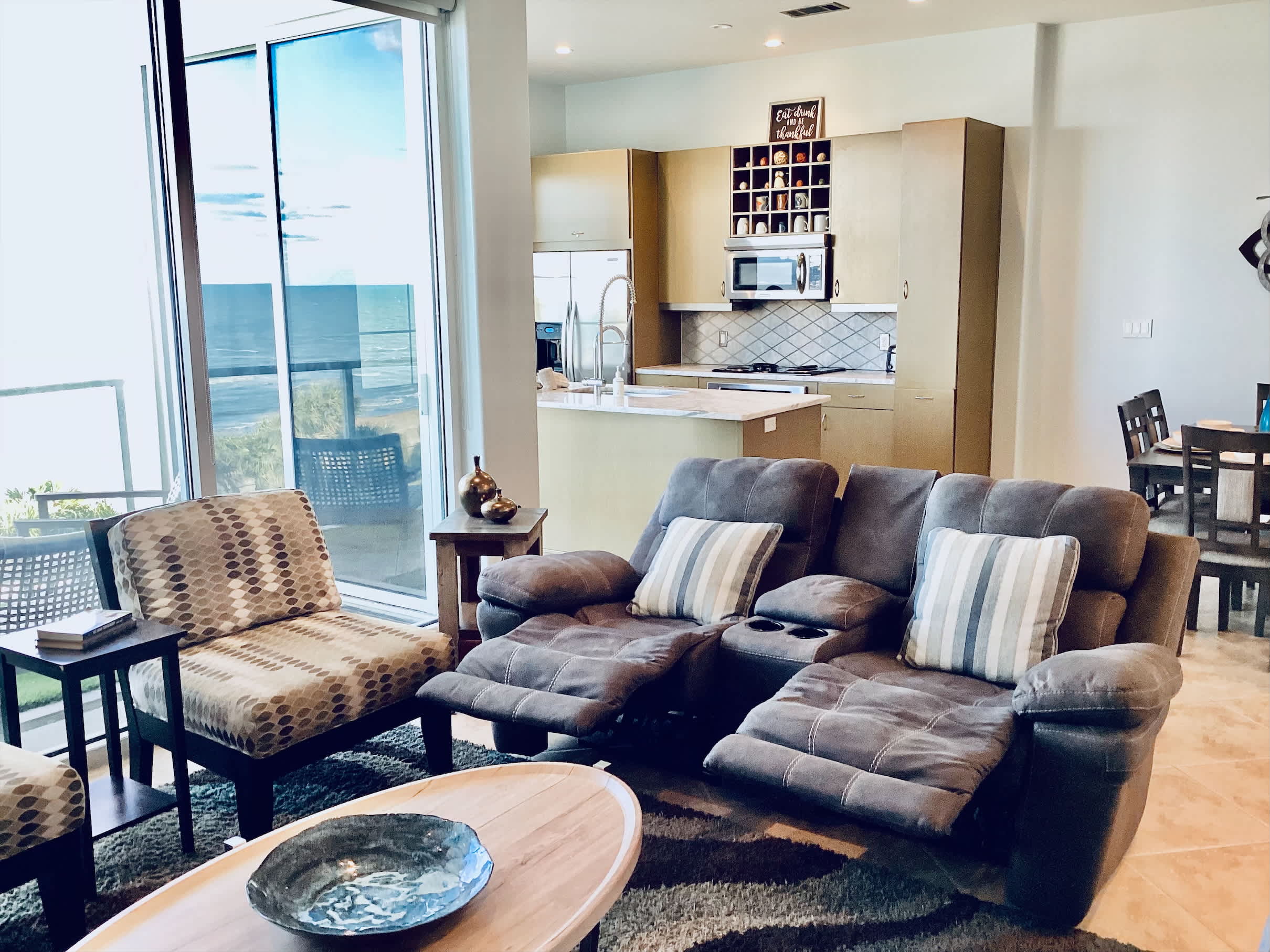 Comfortable living room with smart TV and sweeping ocean views