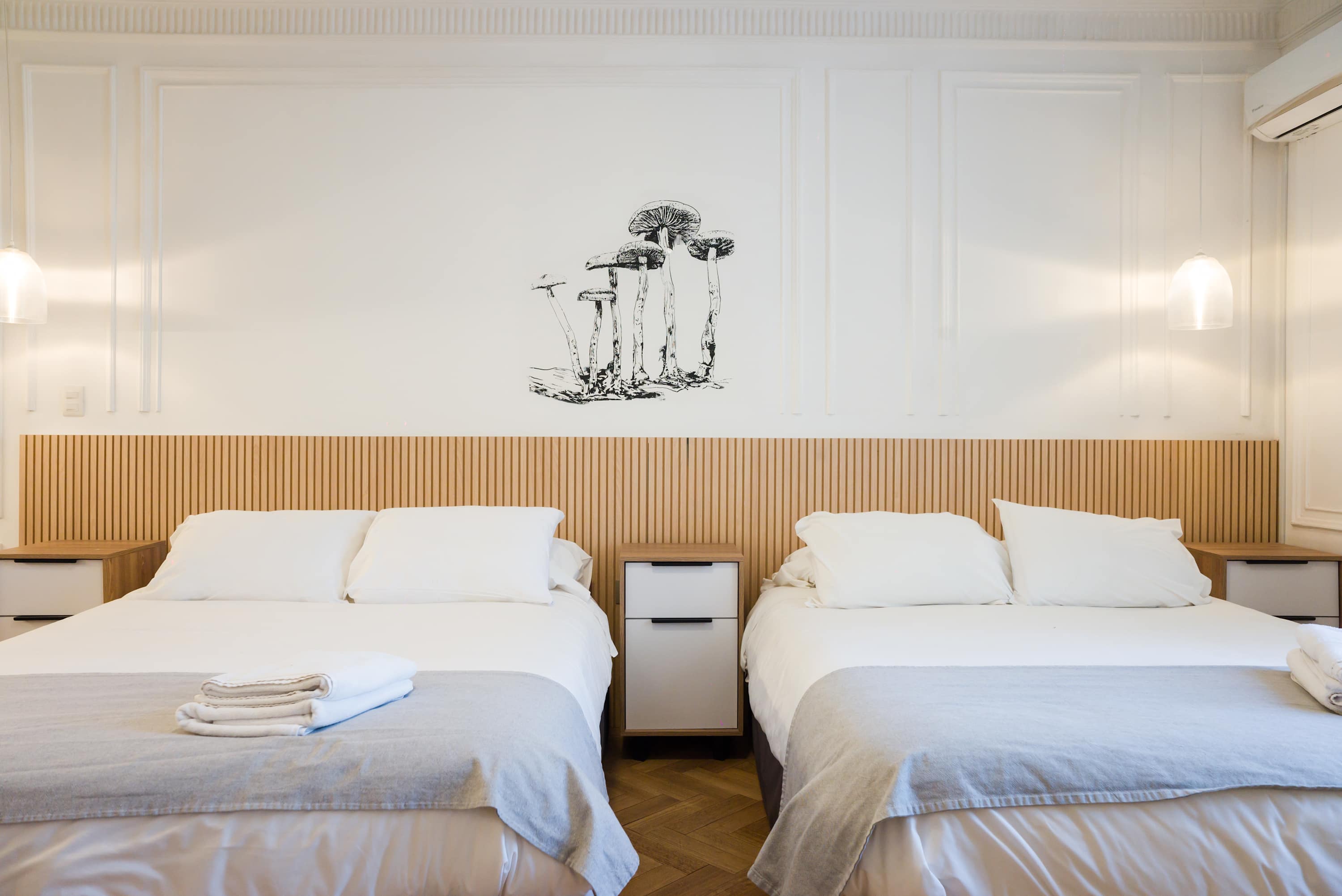 Cozy and stylish sleeping area with modern decor and comfortable bedding, perfect for a relaxing stay.