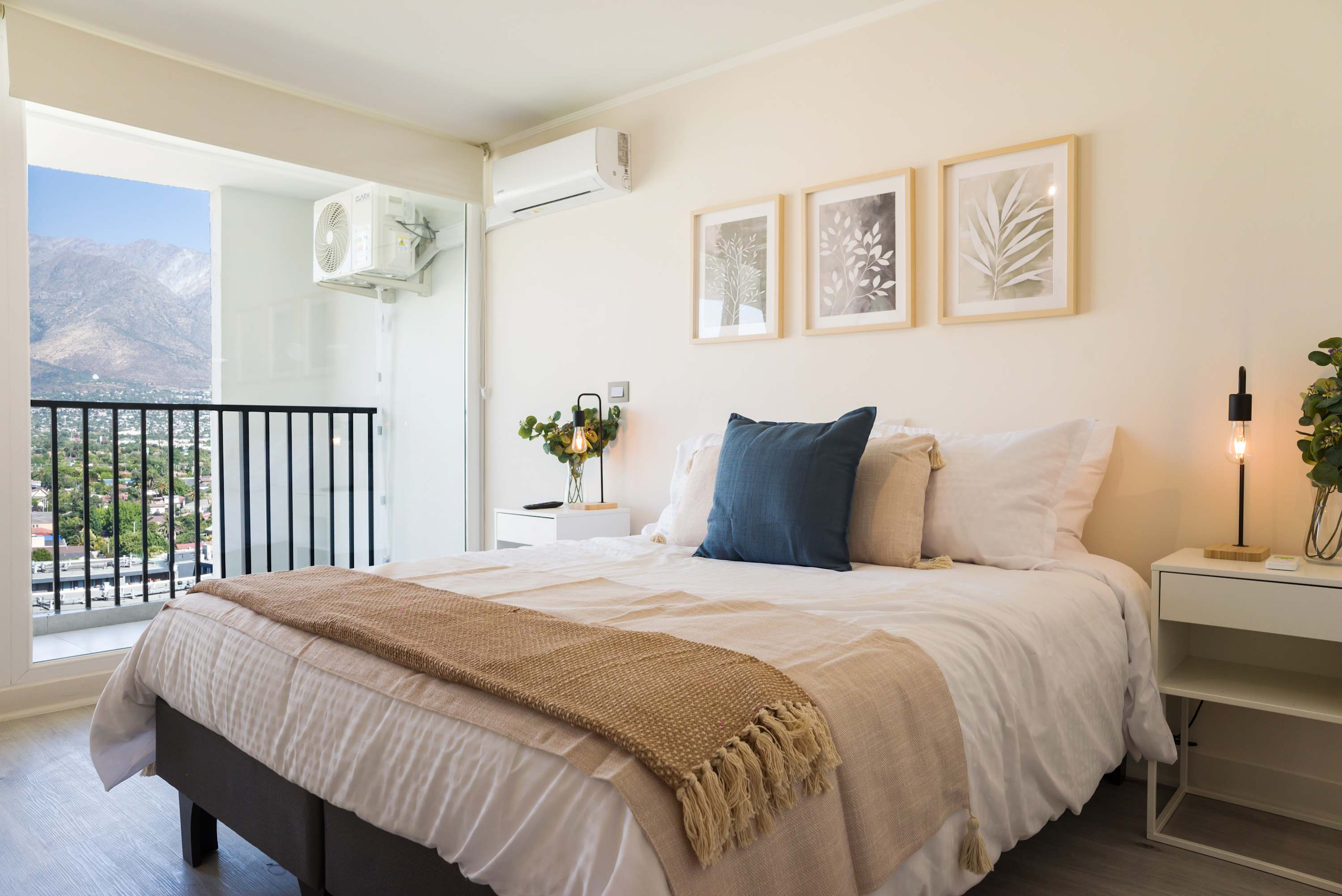 Unwind in this serene bedroom with breathtaking mountain views and chic decor, ideal for a peaceful retreat.