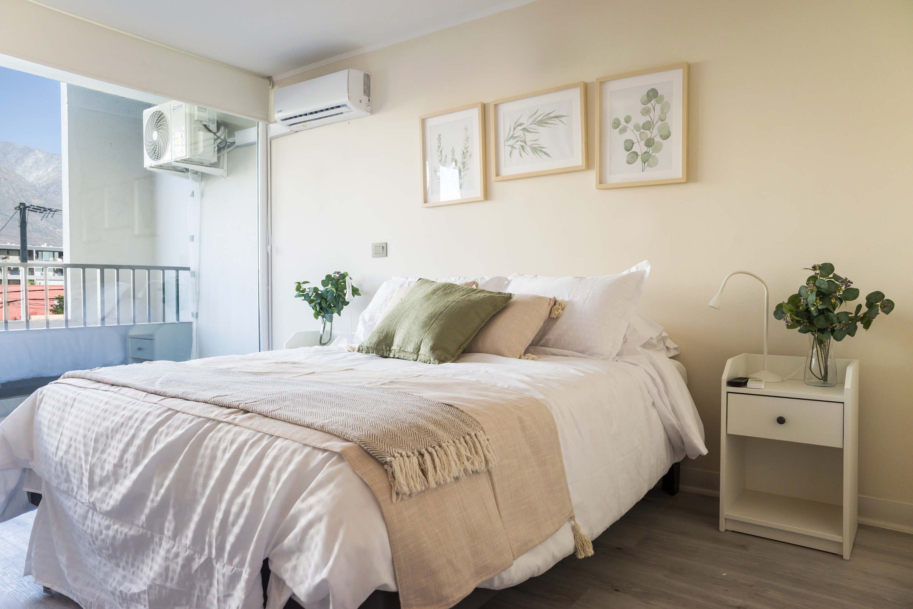 Relax in this cozy bedroom with stunning mountain views and stylish decor, perfect for a peaceful getaway.