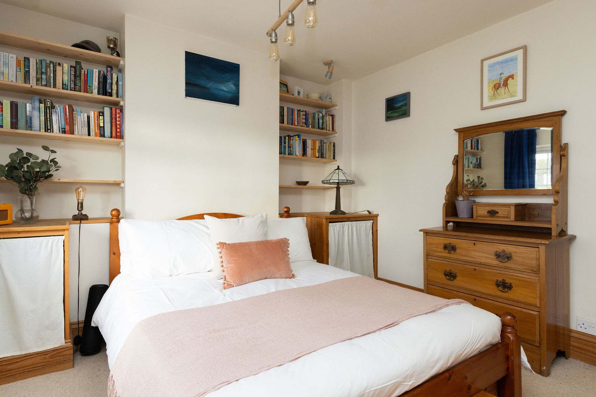 Light and comfortable master bedroom with double bed