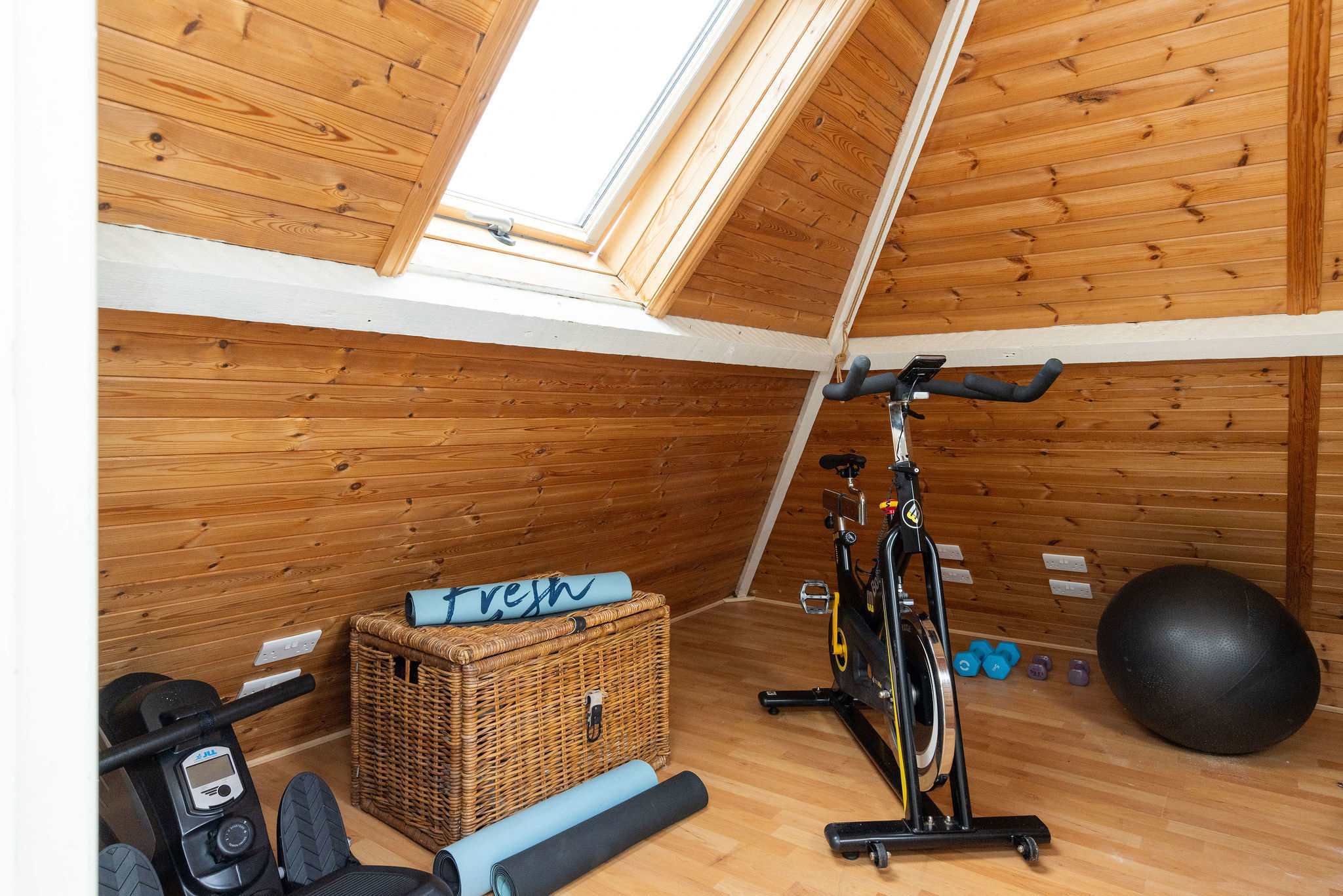Keep-fit area with rowing machine and exercise bike
