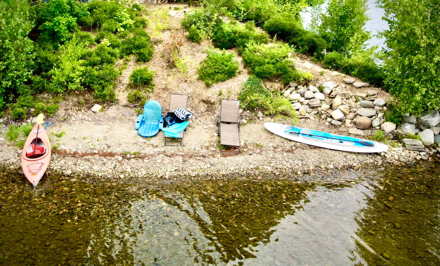 The shared Publc beach at Loon Point.  Seating for humans.  Commentary by loons.