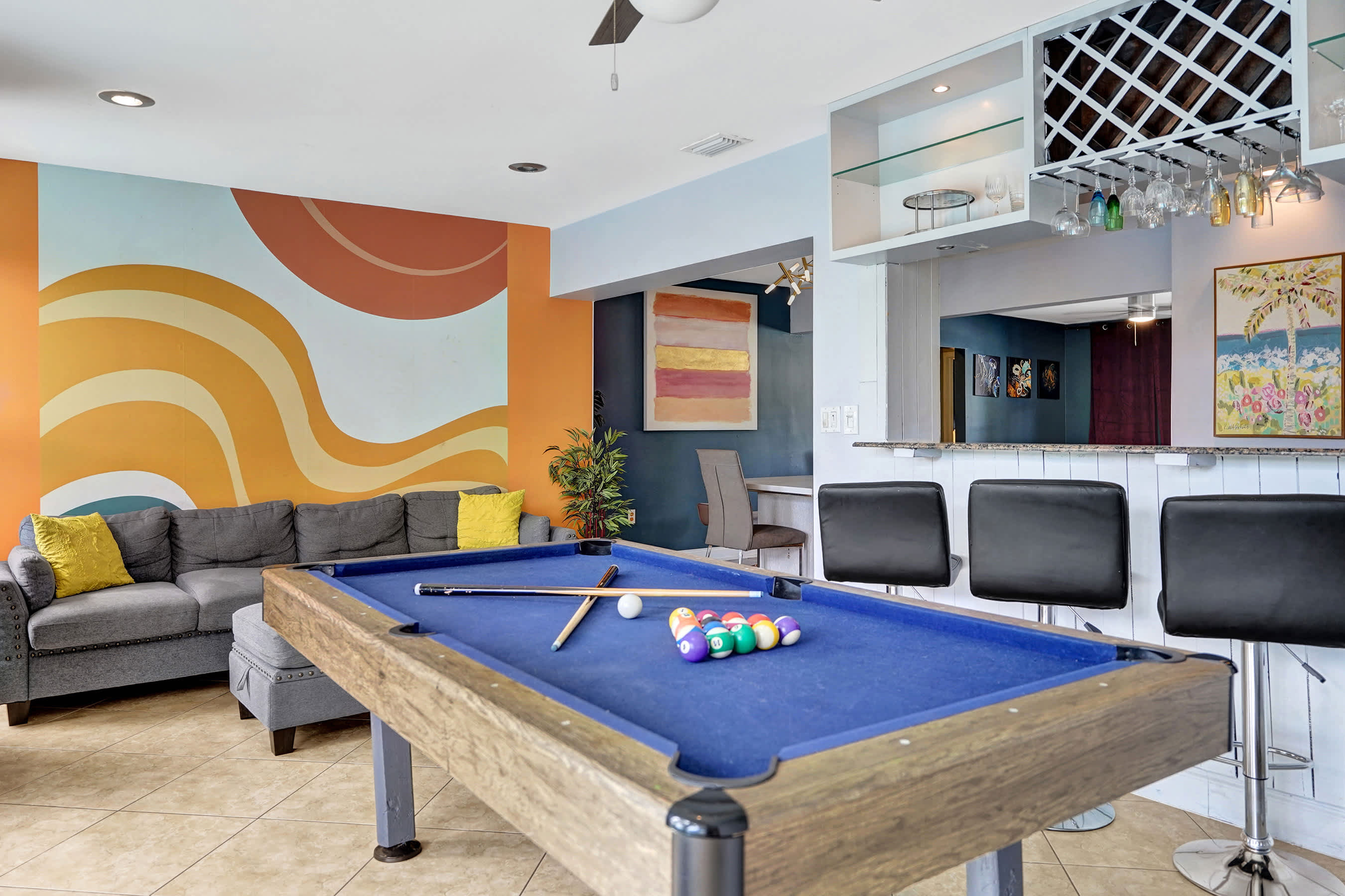 Unit 1’s sunroom is ideal for relaxation or unleashing your competitive side​​