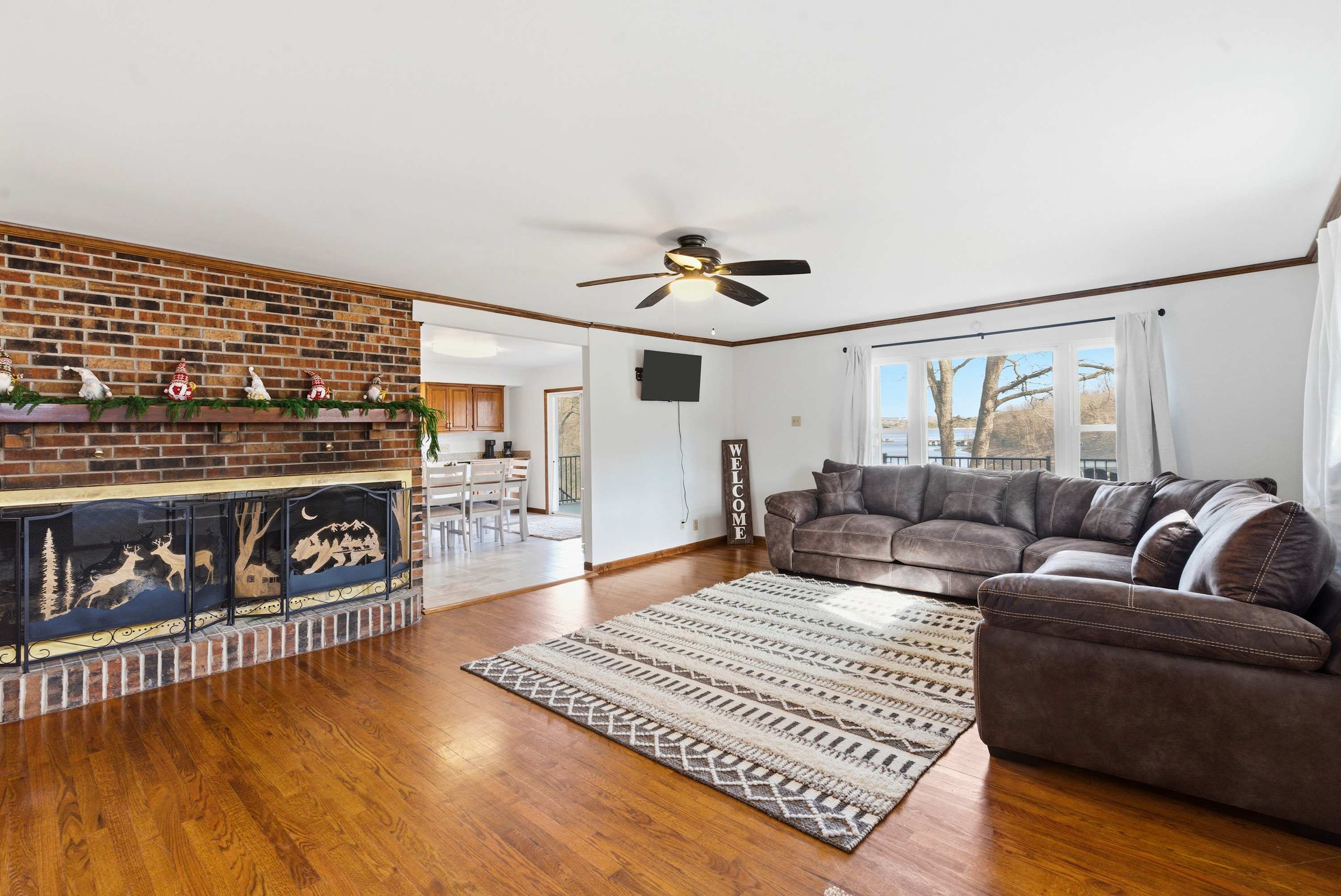Open, inviting living room with ample seating and smart TV