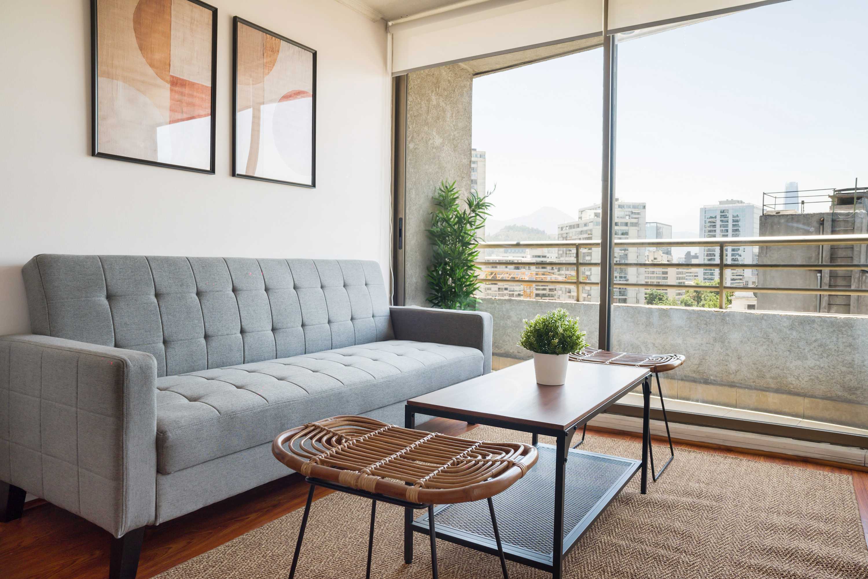 Enjoy breathtaking city views from this chic and cozy living area, perfect for relaxation in the heart of Chile.