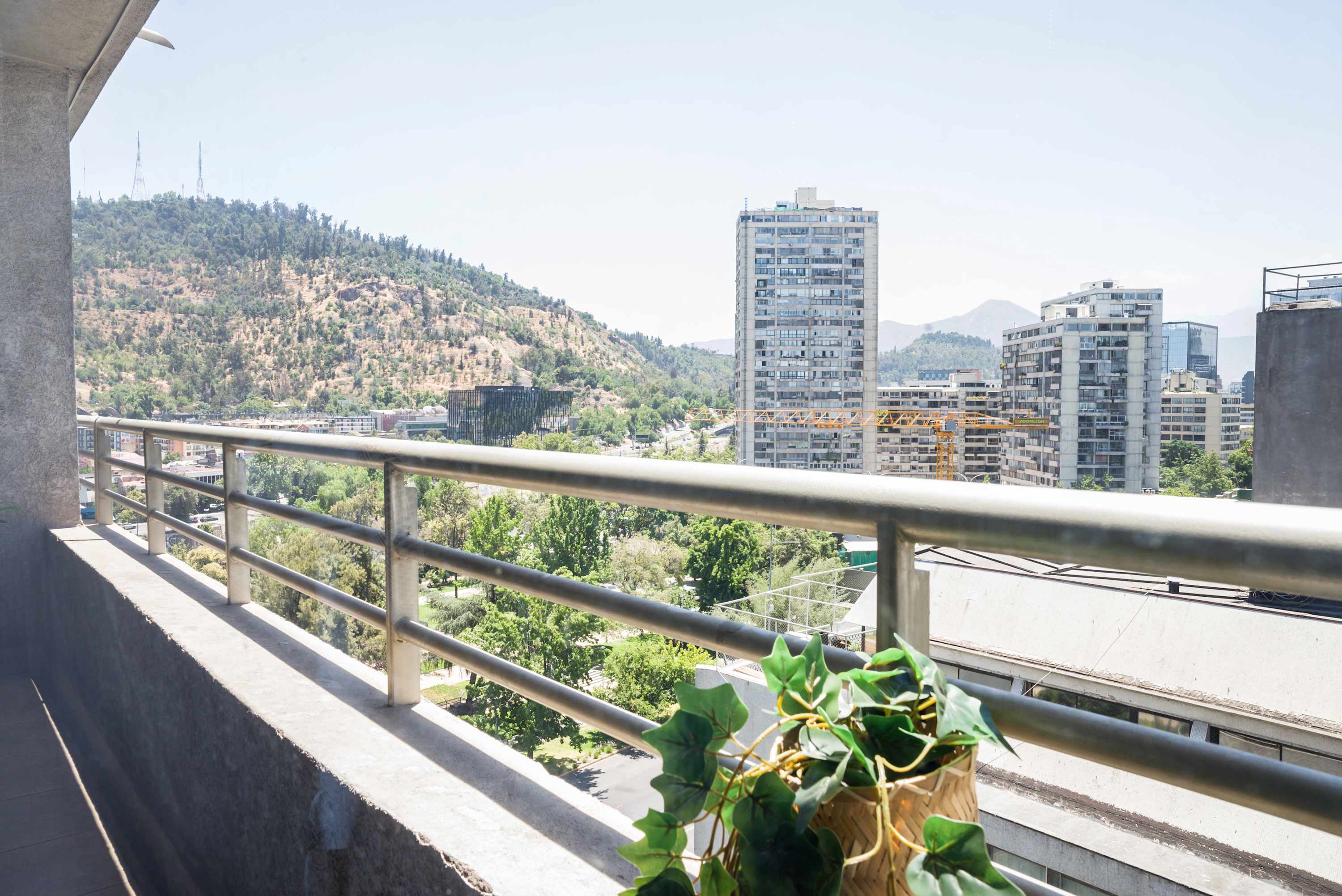 Enjoy breathtaking city and hill views from your private balcony, perfect for relaxation and taking in the scenery.