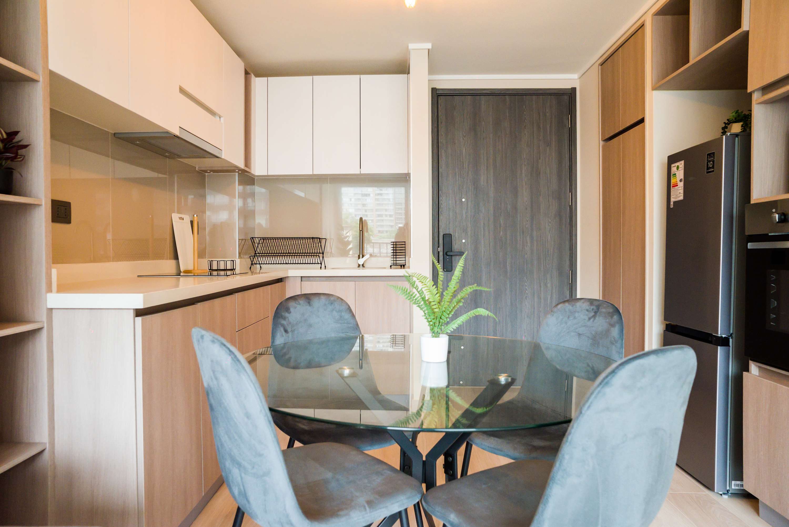 Chic and modern kitchen with sleek finishes, perfect for cozy meals and gatherings.