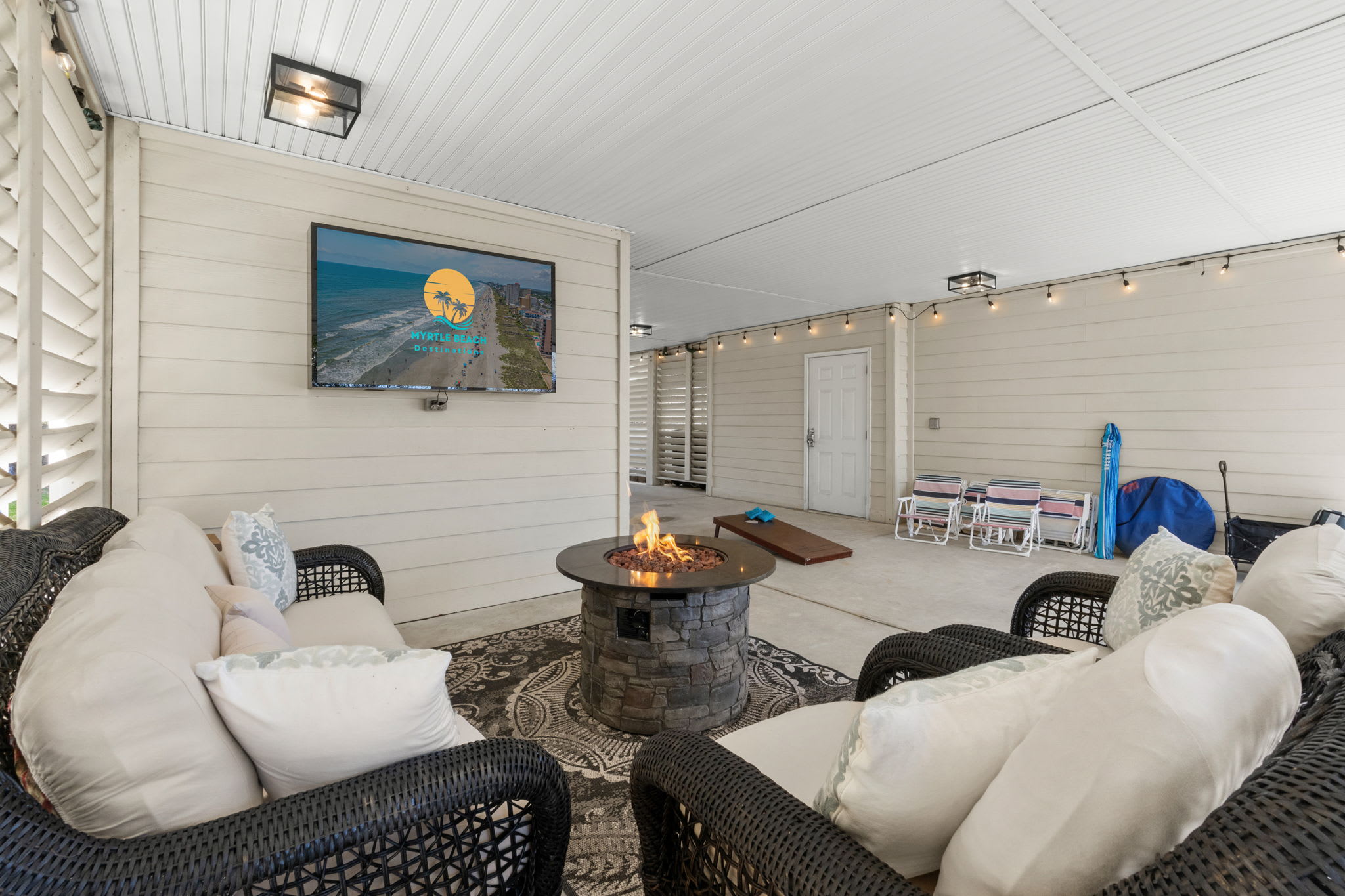 Multiple outdoor seating with TV