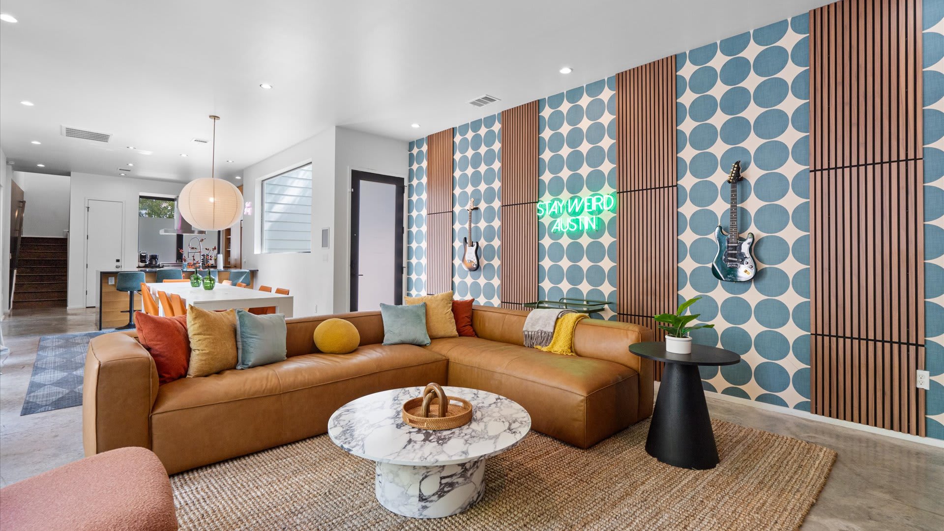 Bright & Stylish Living Area - A sun-filled living room with comfortable seating, modern décor, and large windows.